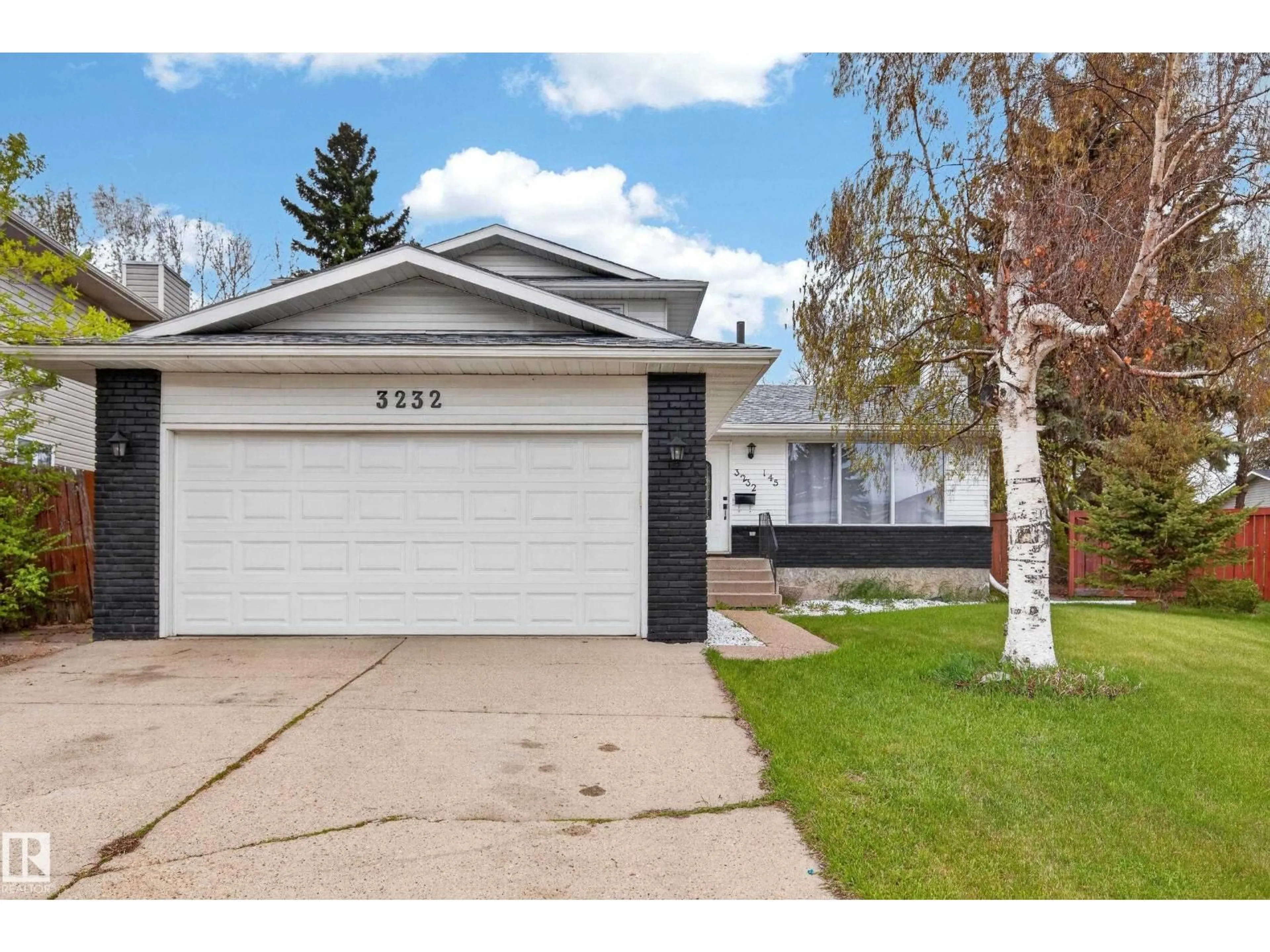 Home with vinyl exterior material, street for NW - 3232 145 AV, Edmonton Alberta T5Y2E5
