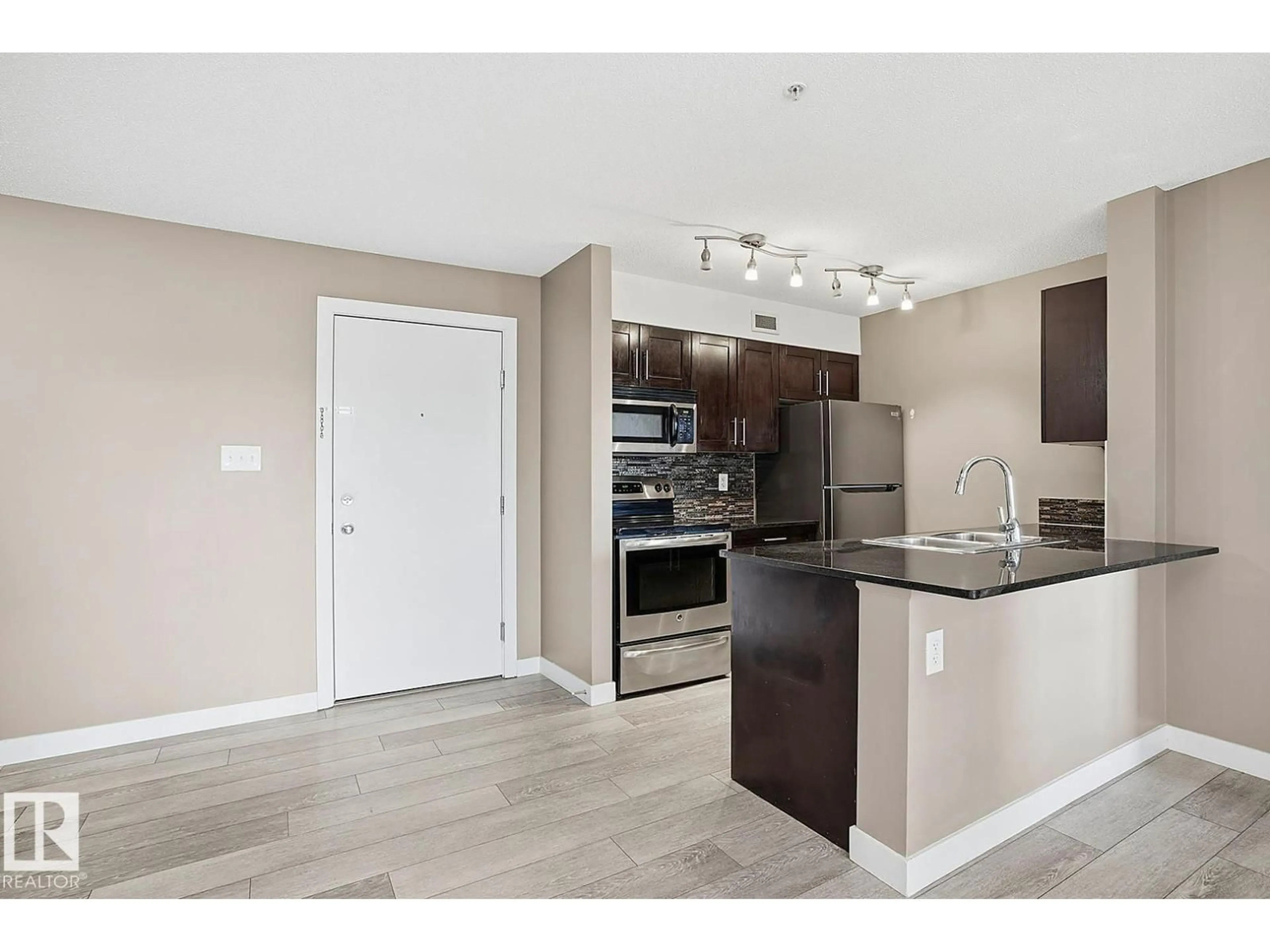 Open concept kitchen, unknown for #109 - 11803 22 AV, Edmonton Alberta T6W2R9