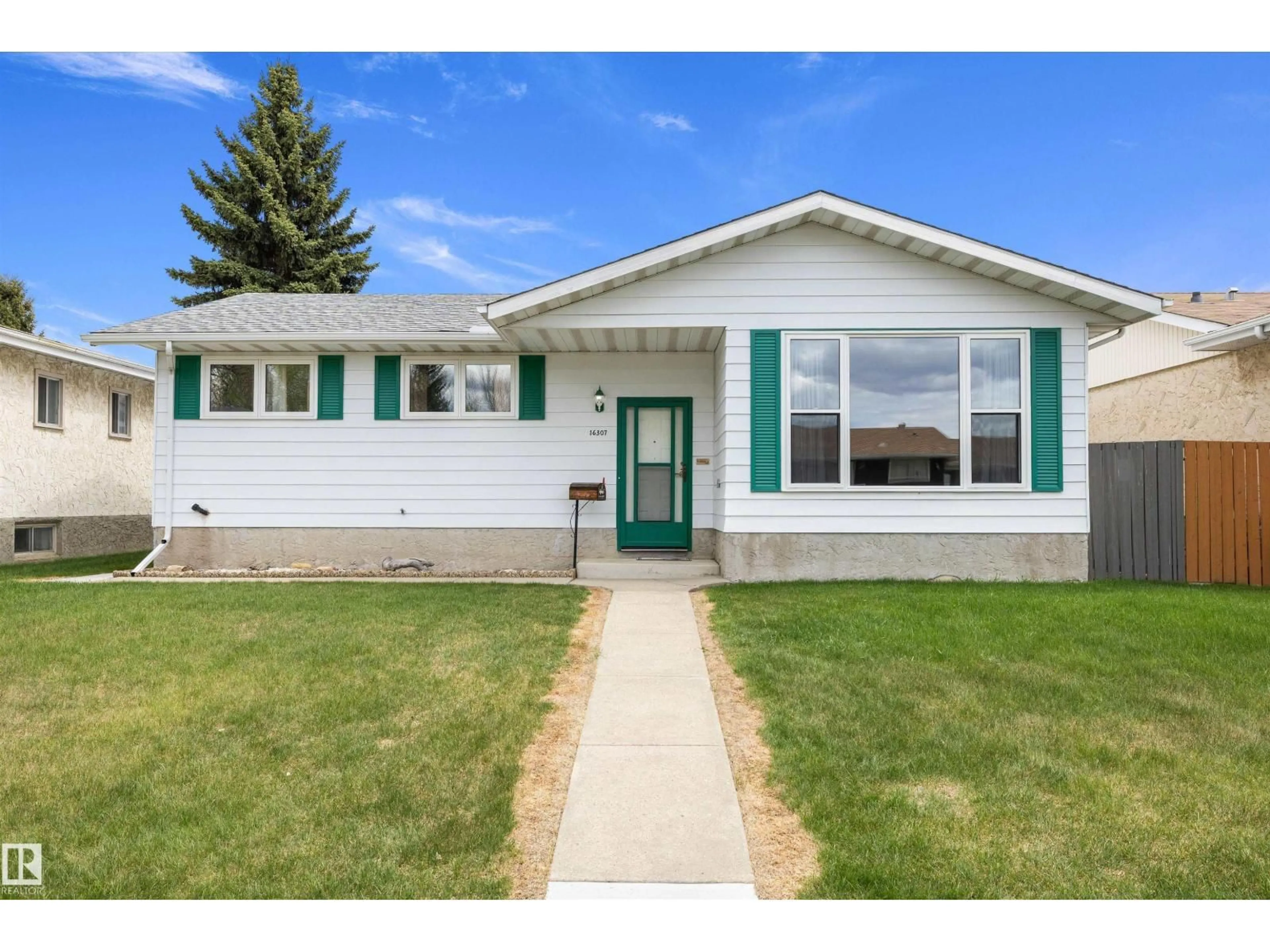 Home with vinyl exterior material, street for 16307 111 ST, Edmonton Alberta T5X2A9