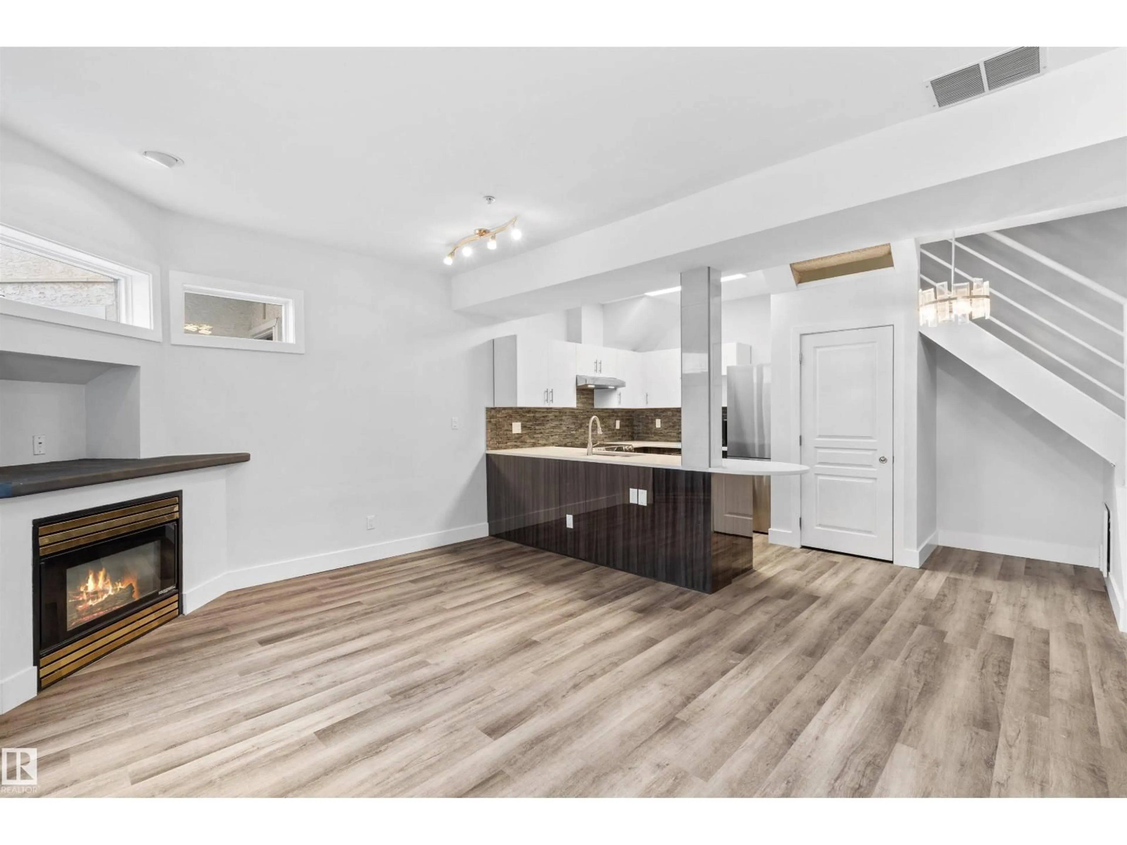 Open concept kitchen, wood/laminate floor for 205 10939 82 AV NW, Edmonton Alberta T6G0S7