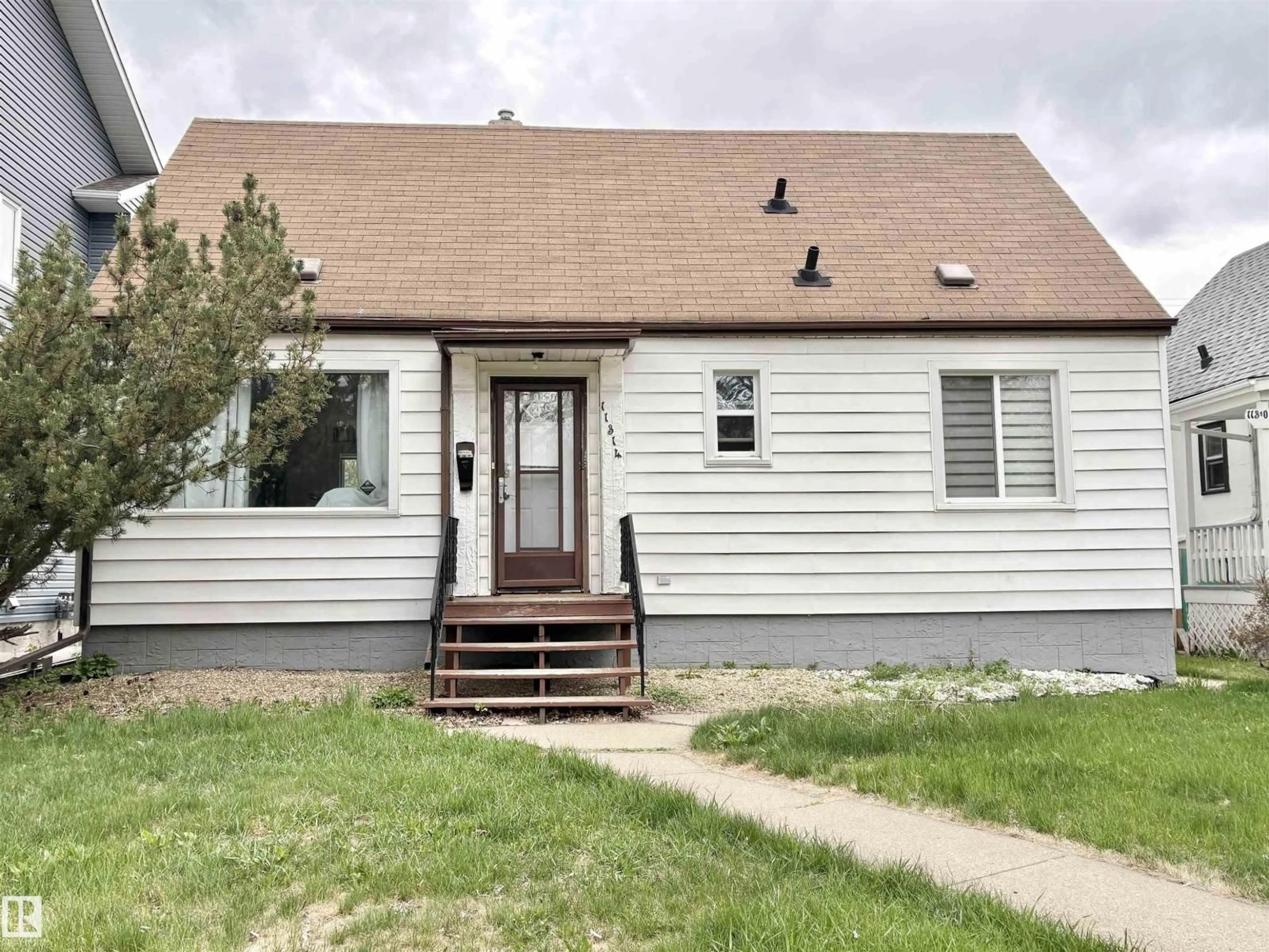 Home with vinyl exterior material, street for NW - 11314 78 ST, Edmonton Alberta T6G0H3