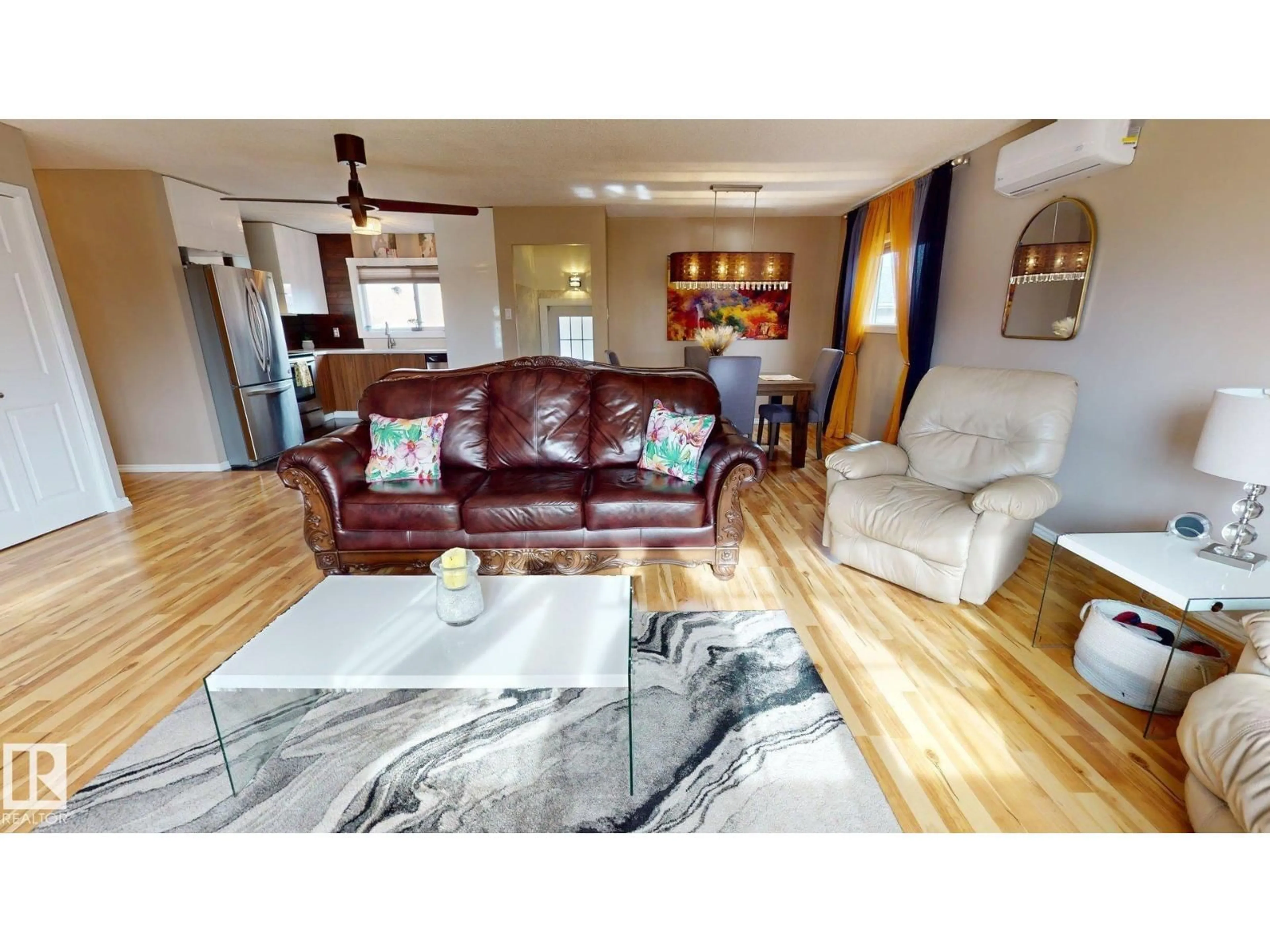 Living room with furniture, wood/laminate floor for 9616 169 ST, Edmonton Alberta T5P3X2