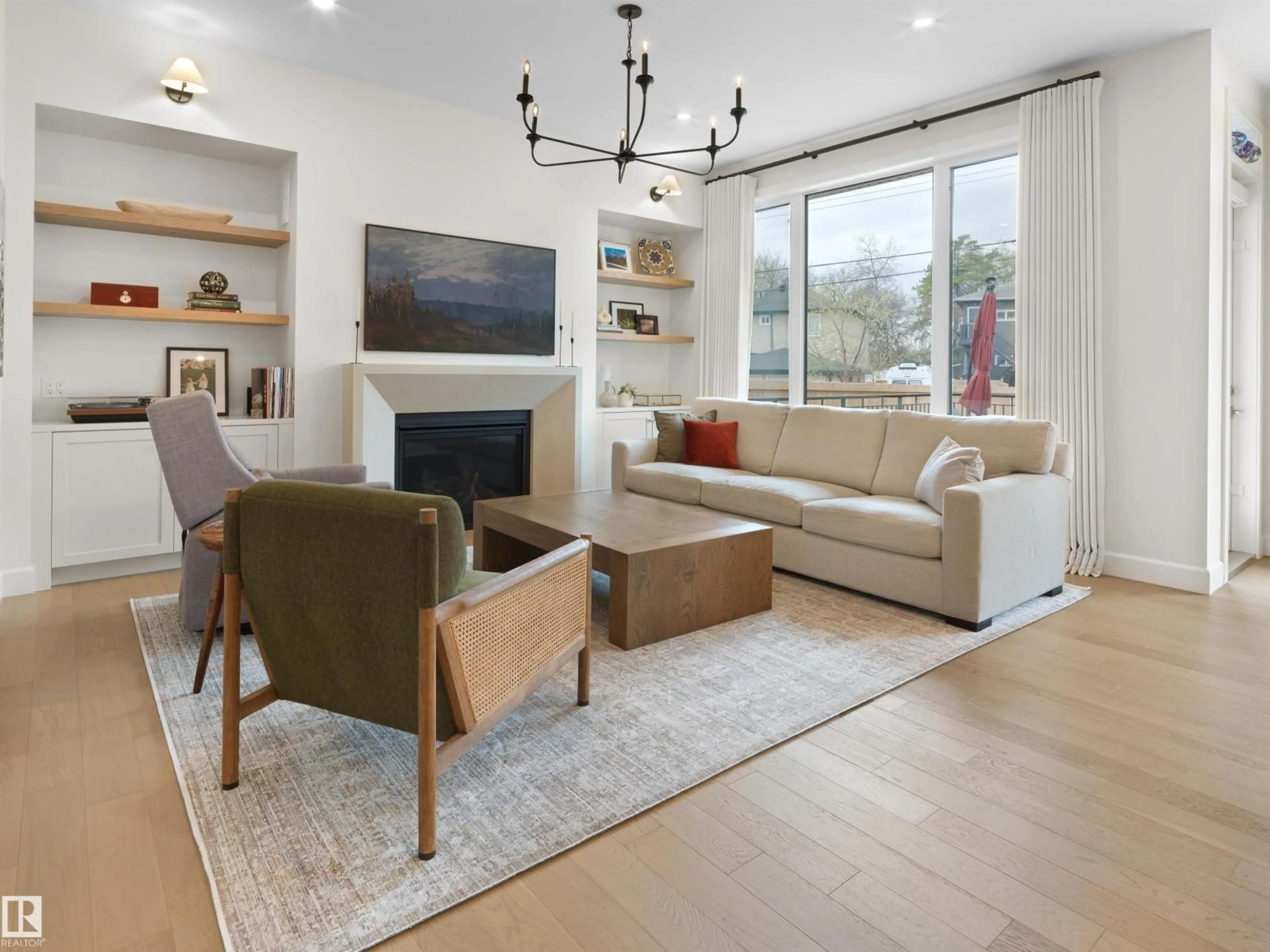 Living room with furniture, wood/laminate floor for 11234 73 AV, Edmonton Alberta T6G0C6