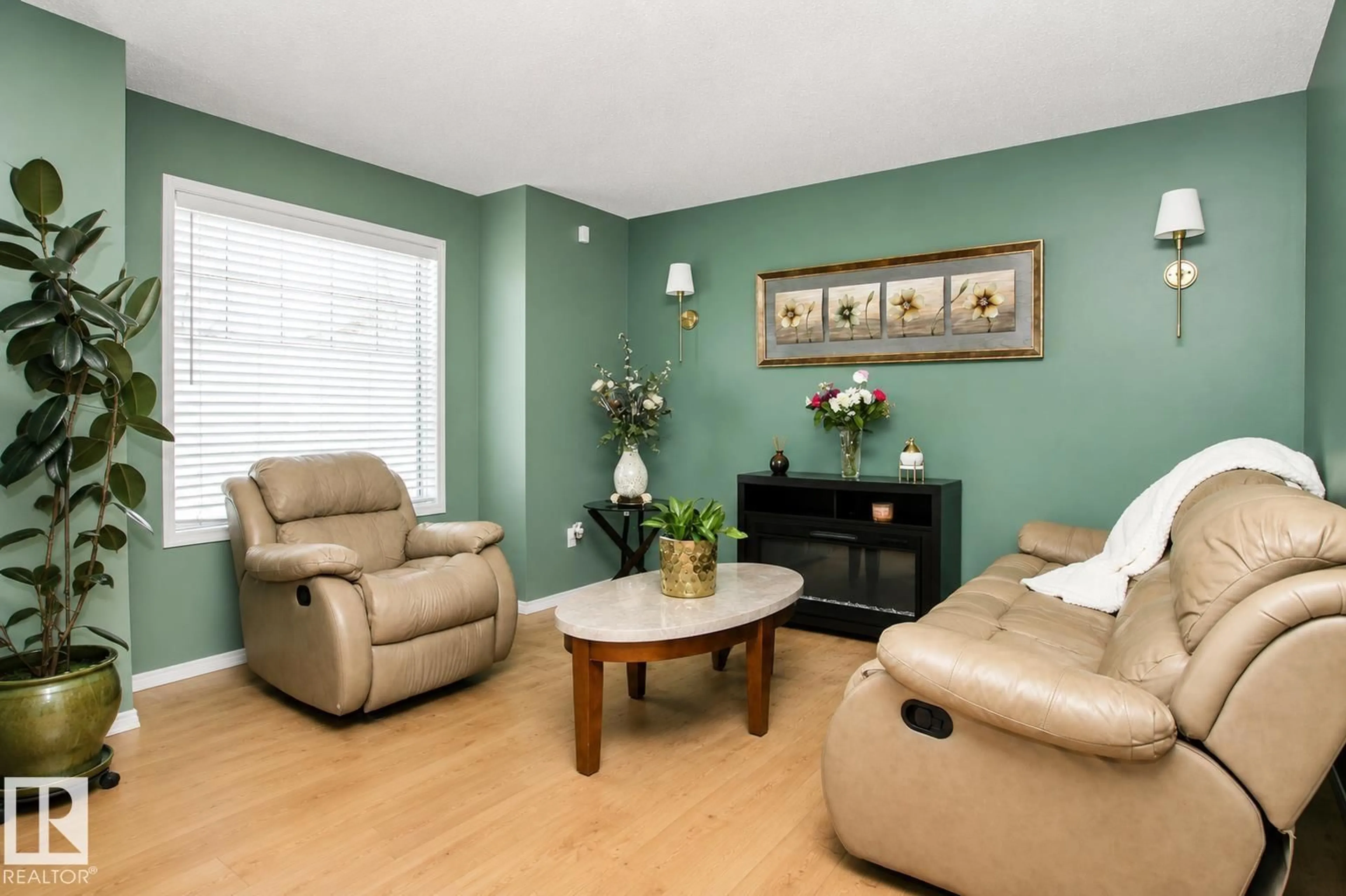Living room with furniture, wood/laminate floor for NW - 17311 90 ST, Edmonton Alberta T5Z3W6