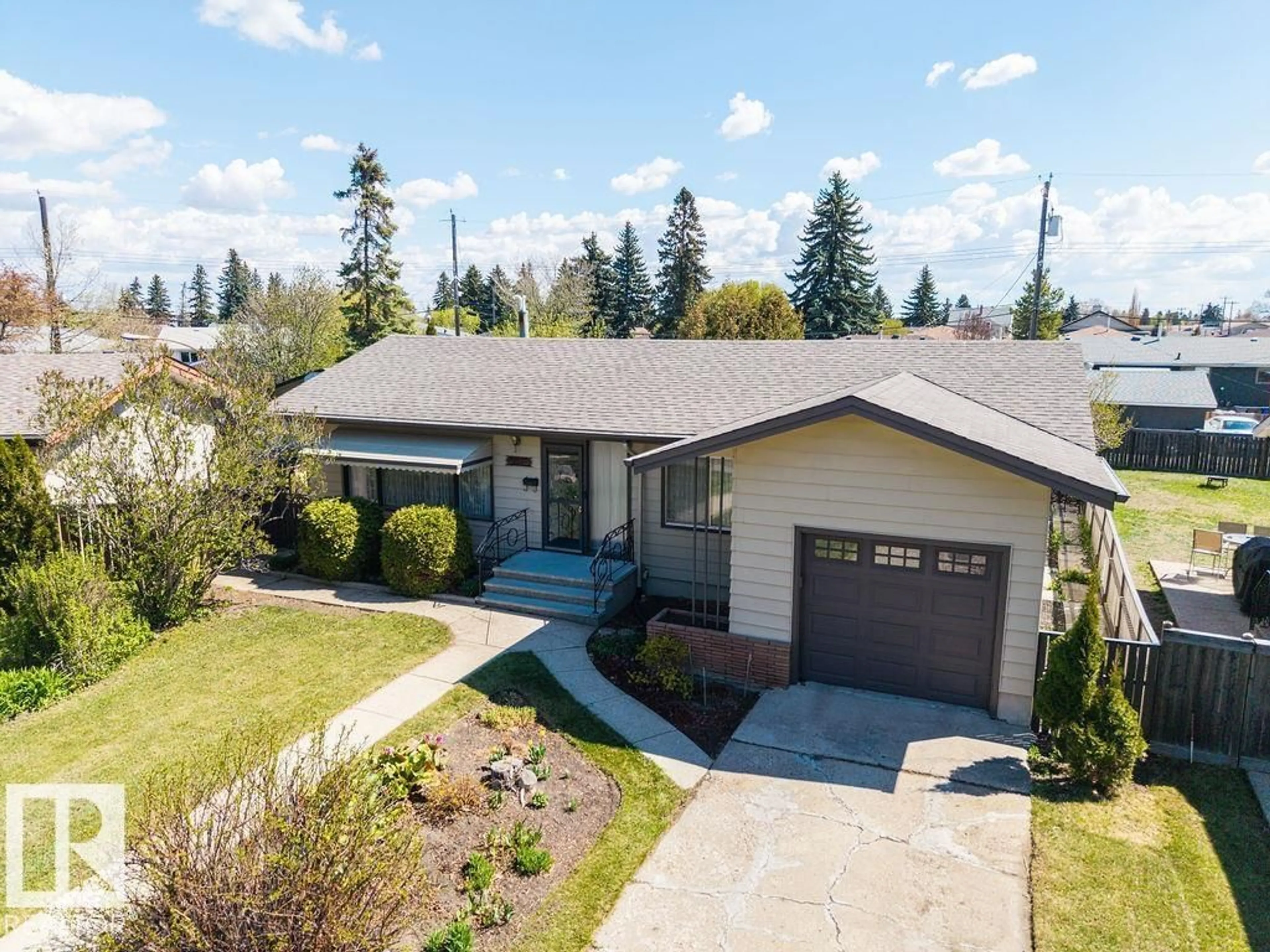 Home with vinyl exterior material, street for 13515 129 ST, Edmonton Alberta T5L1K4