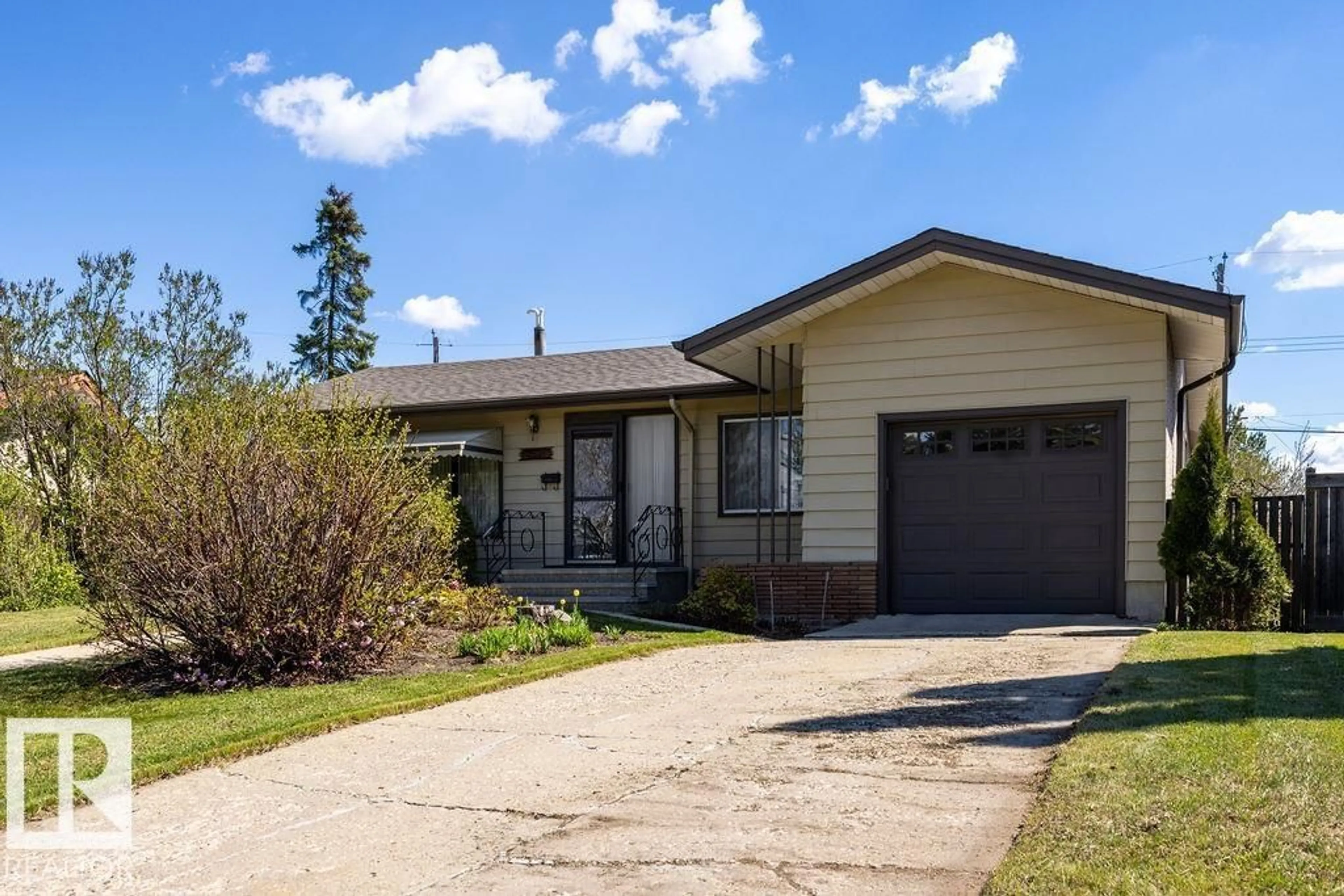 Home with vinyl exterior material, street for 13515 129 ST, Edmonton Alberta T5L1K4