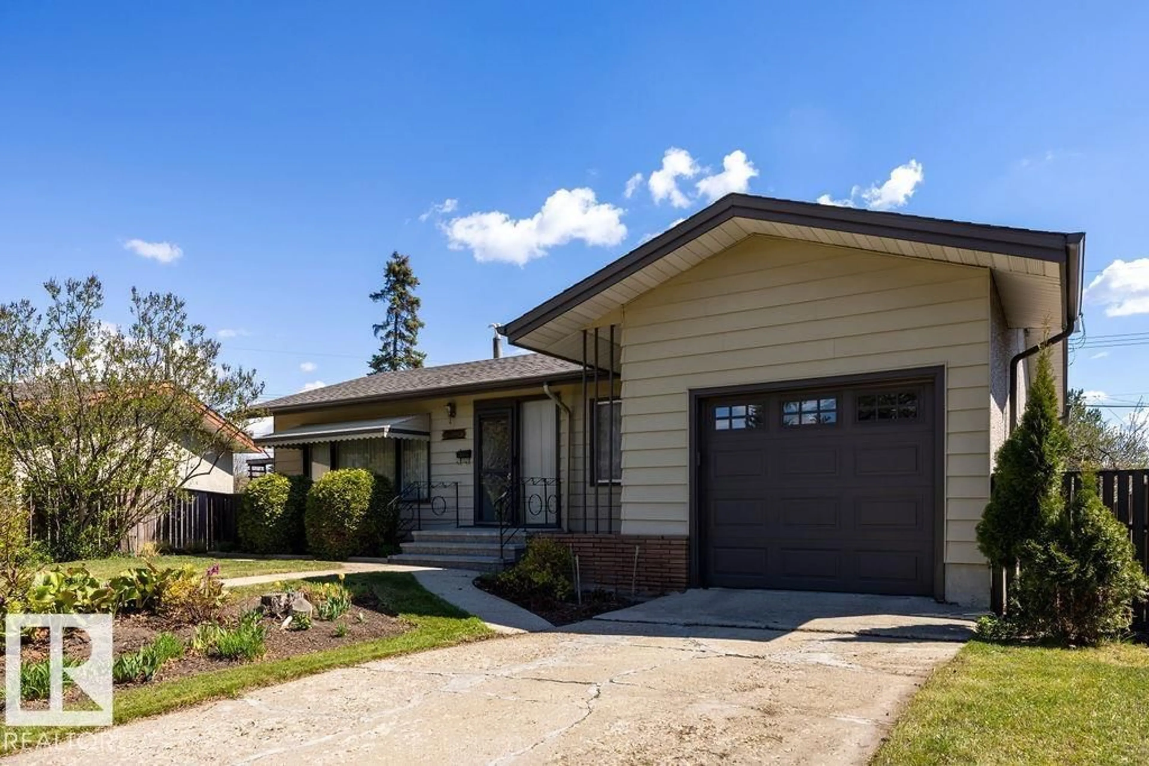 Home with vinyl exterior material, street for 13515 129 ST, Edmonton Alberta T5L1K4