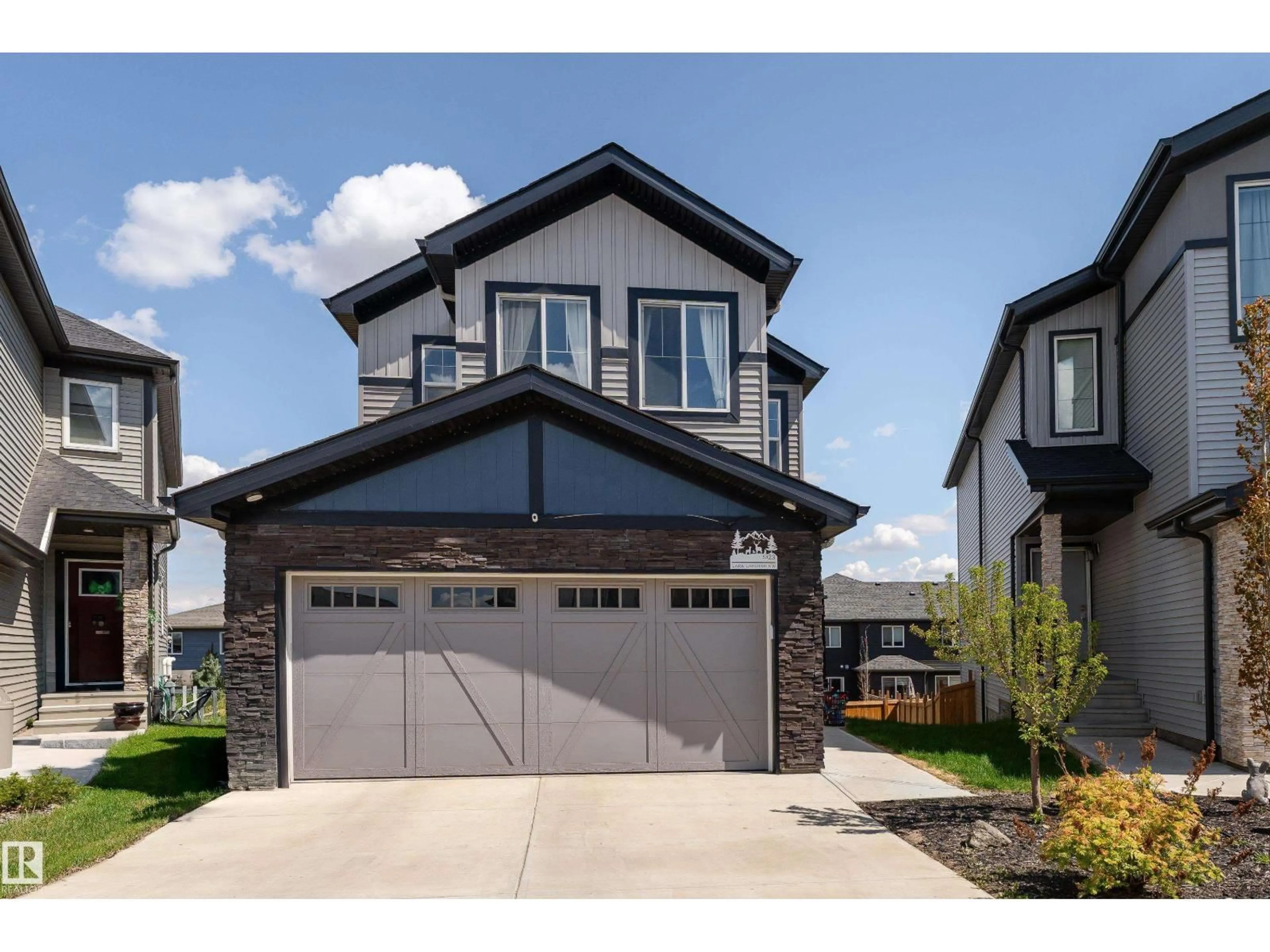 Home with vinyl exterior material, street for 5323 LARK LANDING LD, Edmonton Alberta T5S0P2