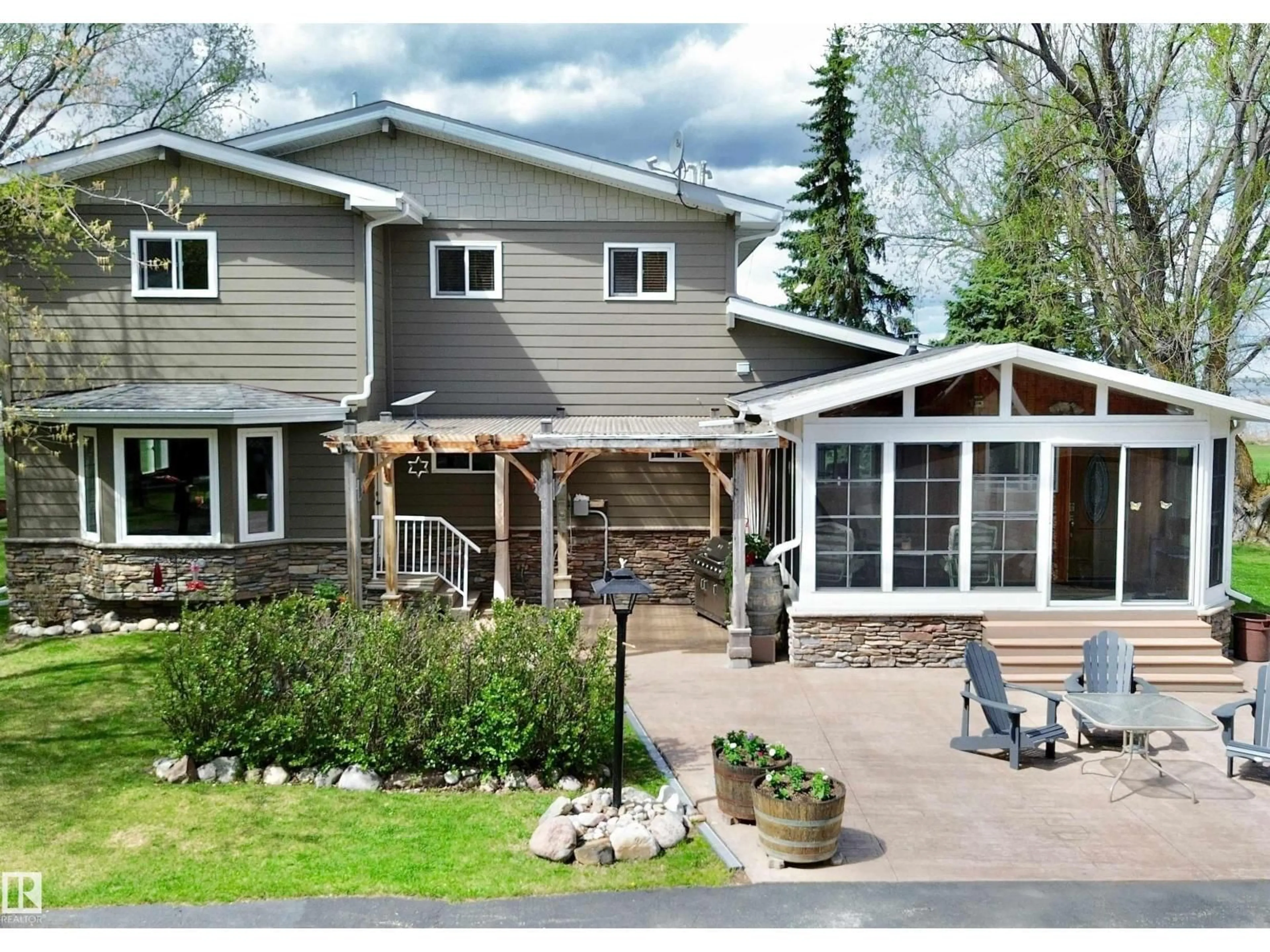 Home with vinyl exterior material, street for #4 - 54524 STE. ANNE TR, Rural Lac Ste. Anne County Alberta T0E0A0