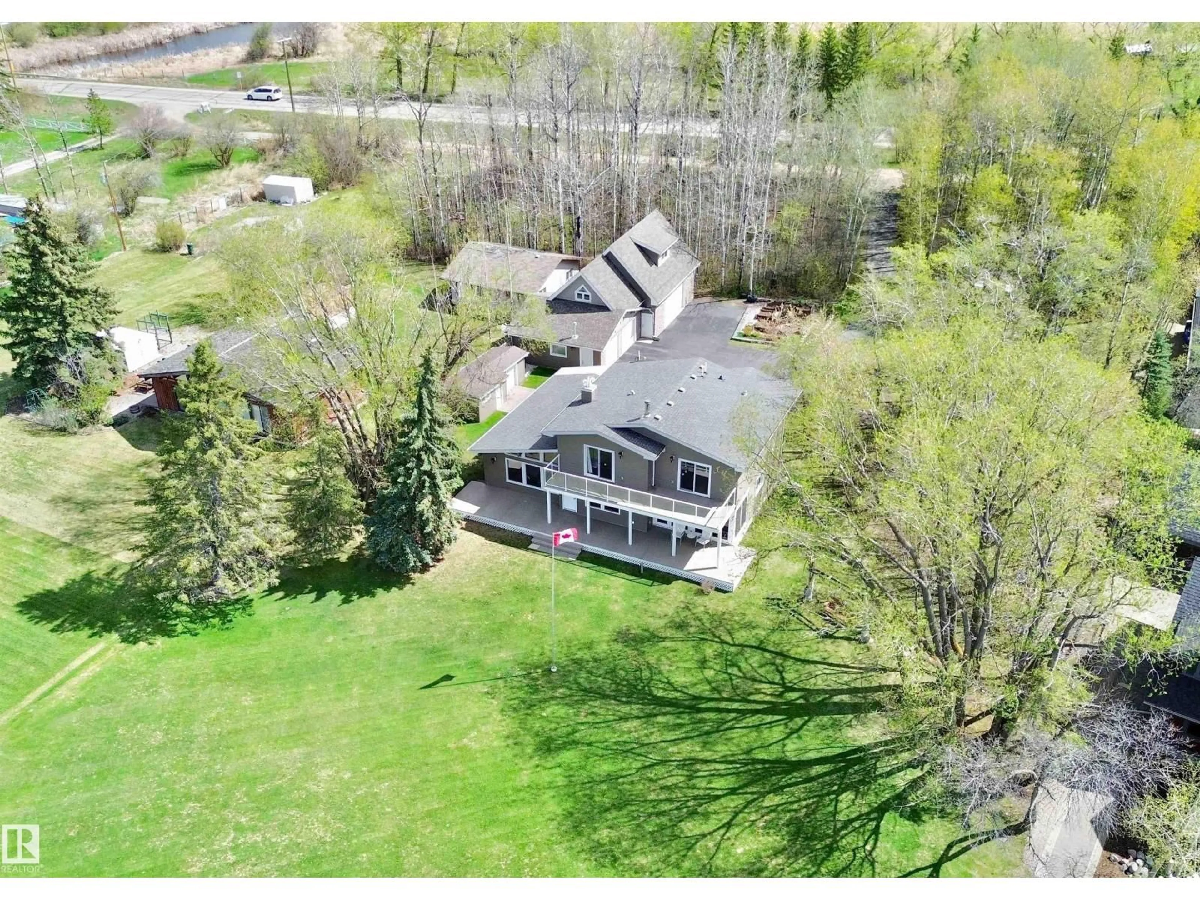 A pic from outside/outdoor area/front of a property/back of a property/a pic from drone, water/lake/river/ocean view for #4 - 54524 STE. ANNE TR, Rural Lac Ste. Anne County Alberta T0E0A0