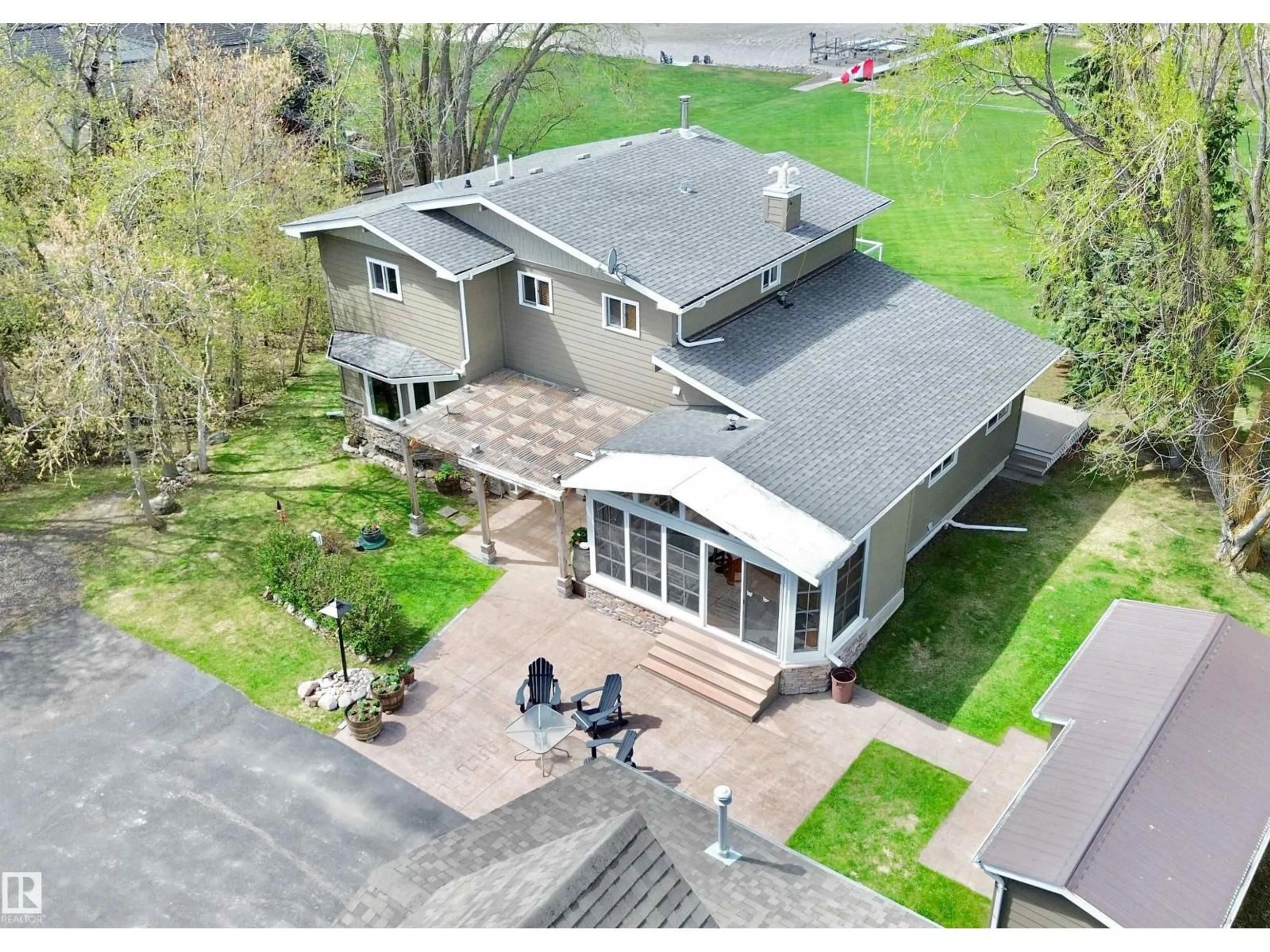 A pic from outside/outdoor area/front of a property/back of a property/a pic from drone, street for #4 - 54524 STE. ANNE TR, Rural Lac Ste. Anne County Alberta T0E0A0
