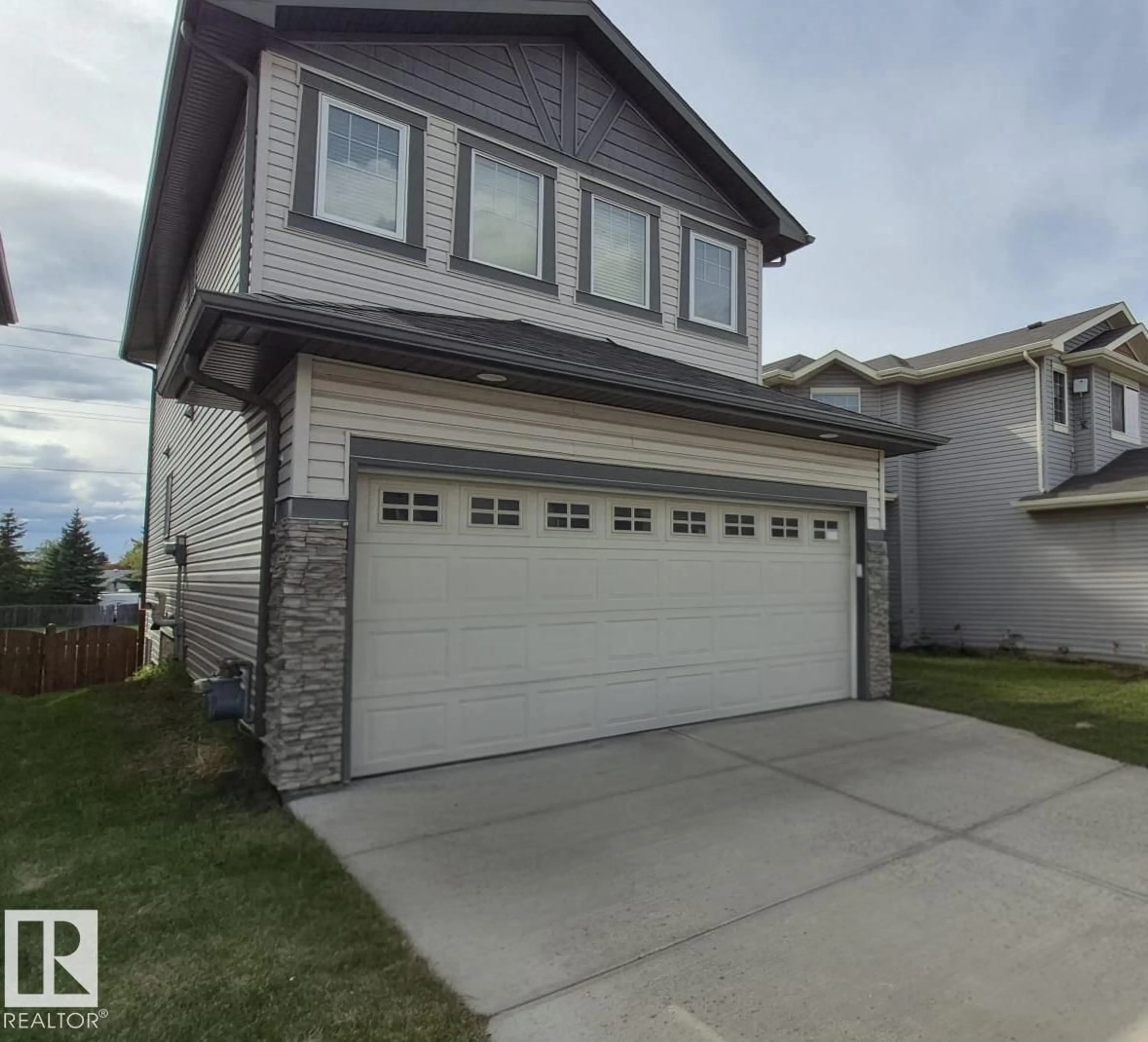 Home with vinyl exterior material, street for NW - 2044 33B ST, Edmonton Alberta T6T0L2