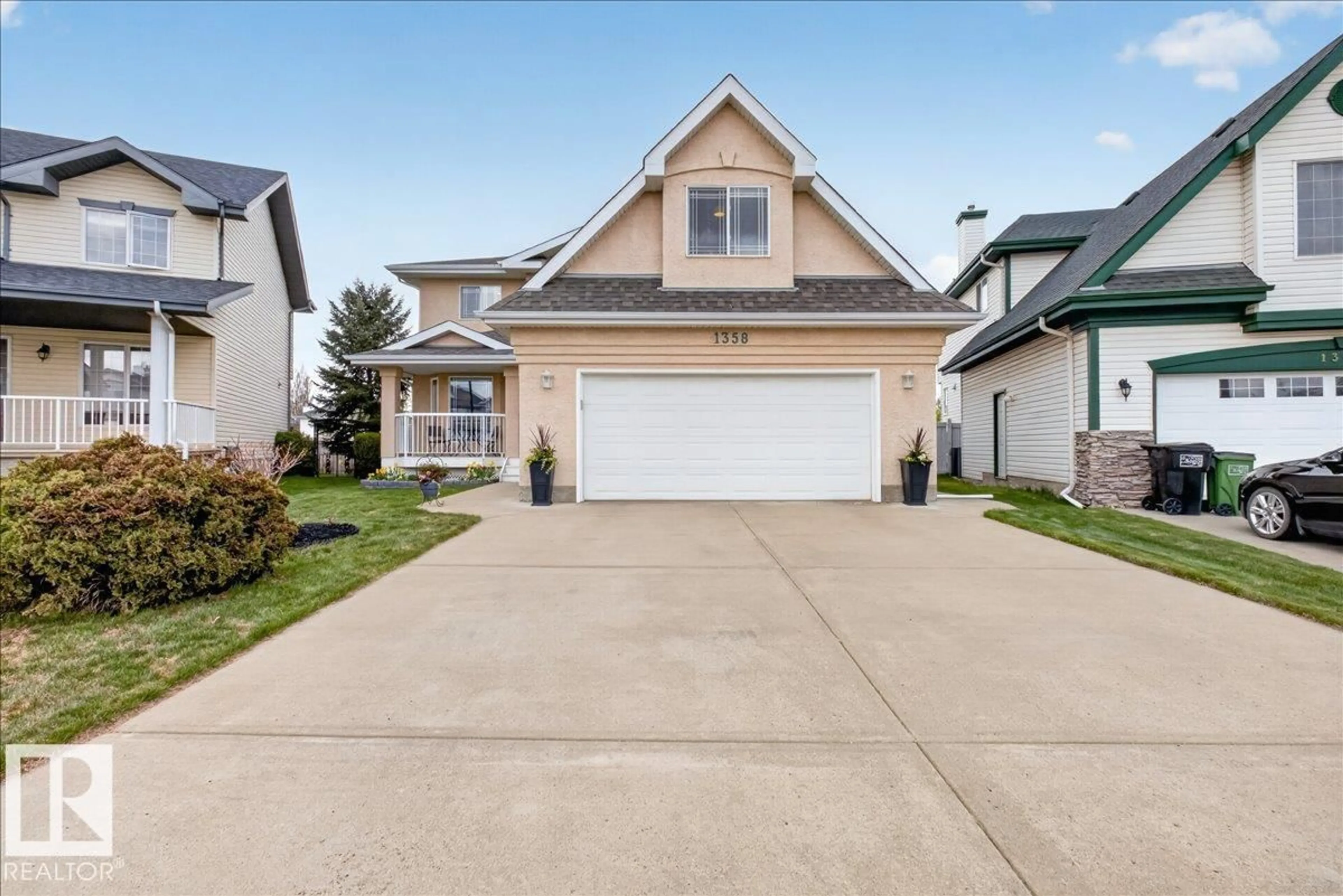 Home with vinyl exterior material, street for NW - 1358 118A ST, Edmonton Alberta T6J7G2