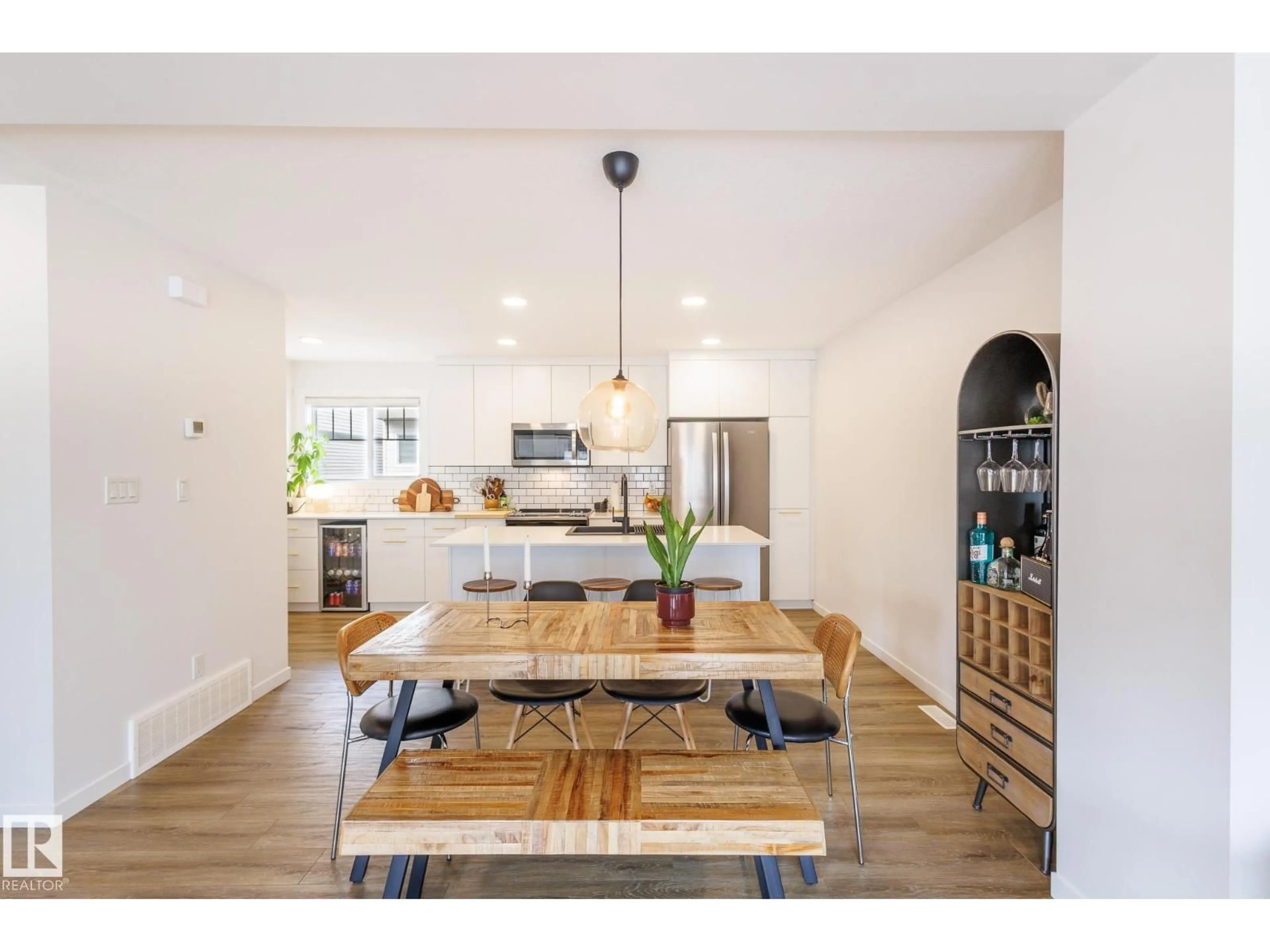 Open concept kitchen, wood/laminate floor for #104 - 1530 TAMARACK BV, Edmonton Alberta T6T2E6