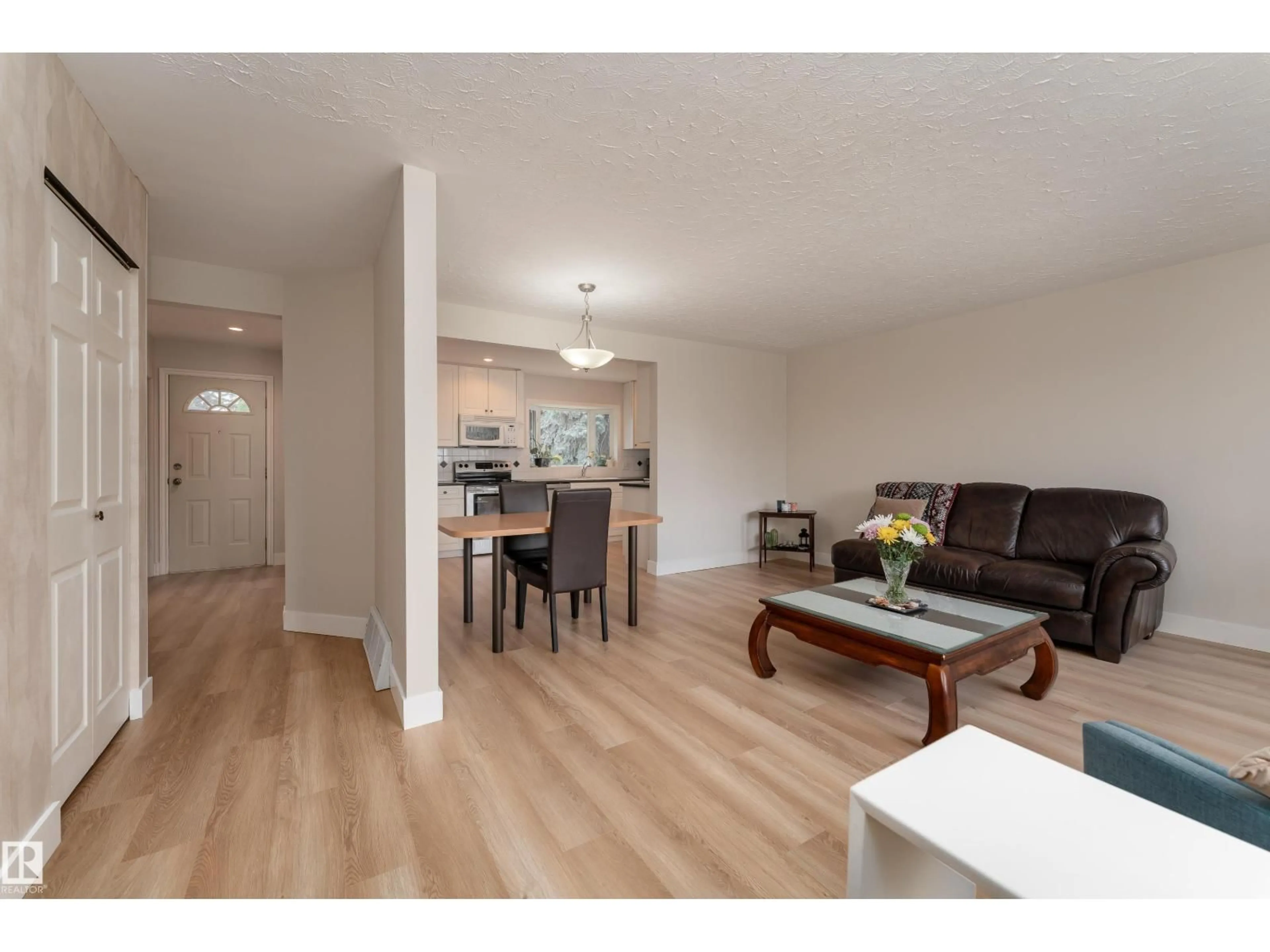 Living room with furniture, wood/laminate floor for 15241 85 AV, Edmonton Alberta T8R3Z8