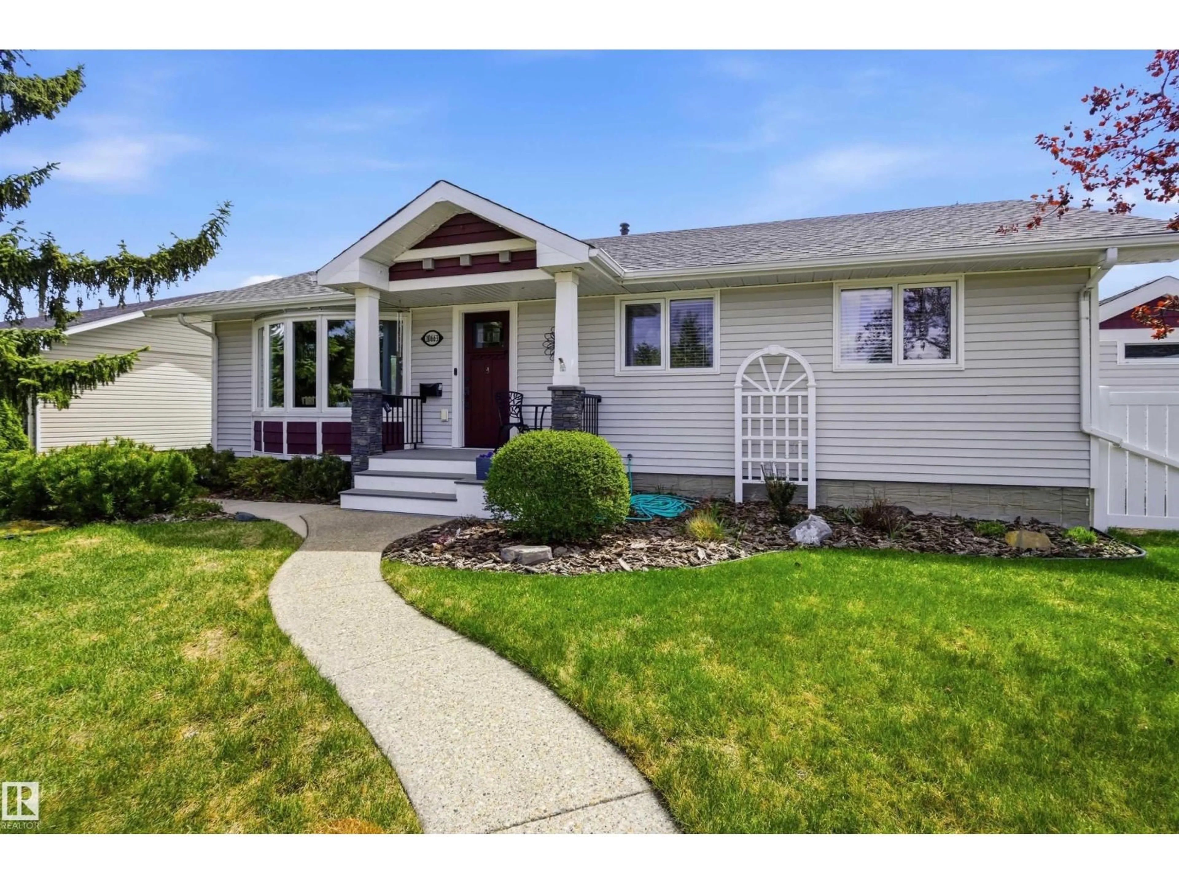 Home with vinyl exterior material, street for NW - 10663 59 ST, Edmonton Alberta T6A2K5