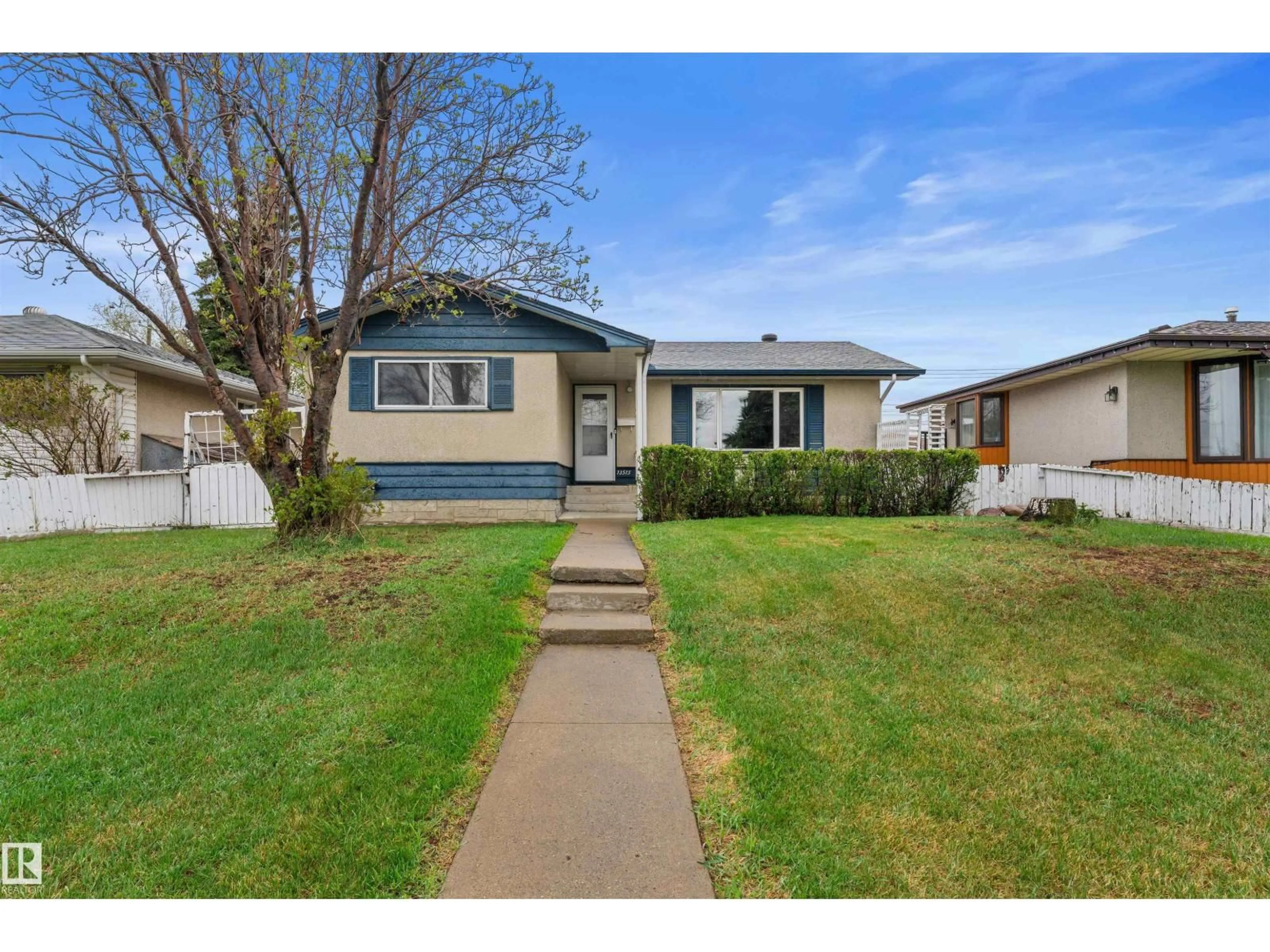 Home with vinyl exterior material, street for 13515 59 ST NW, Edmonton Alberta T5A0S1