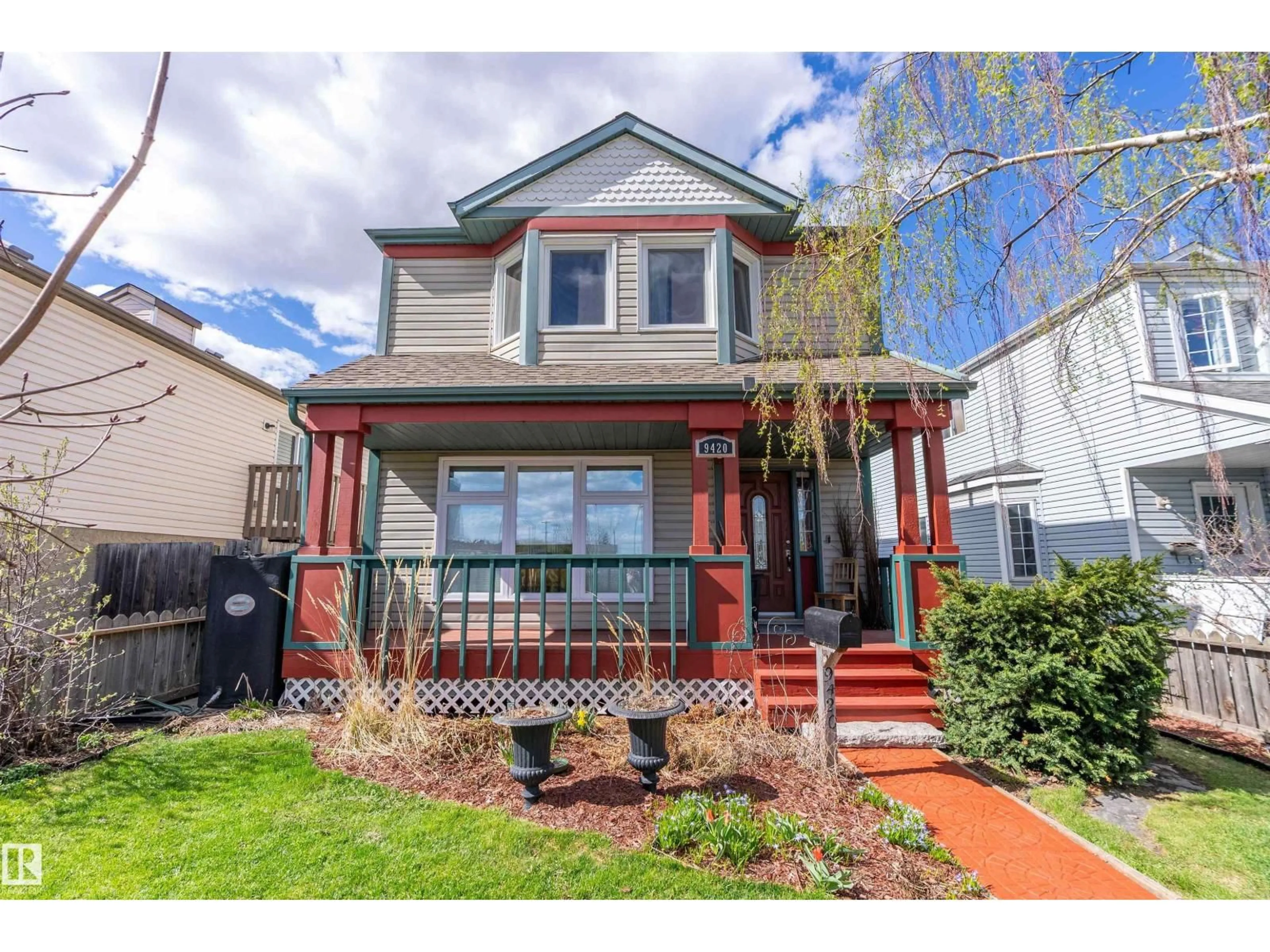 Home with vinyl exterior material, street for 9420 102A AV, Edmonton Alberta T5H4L7