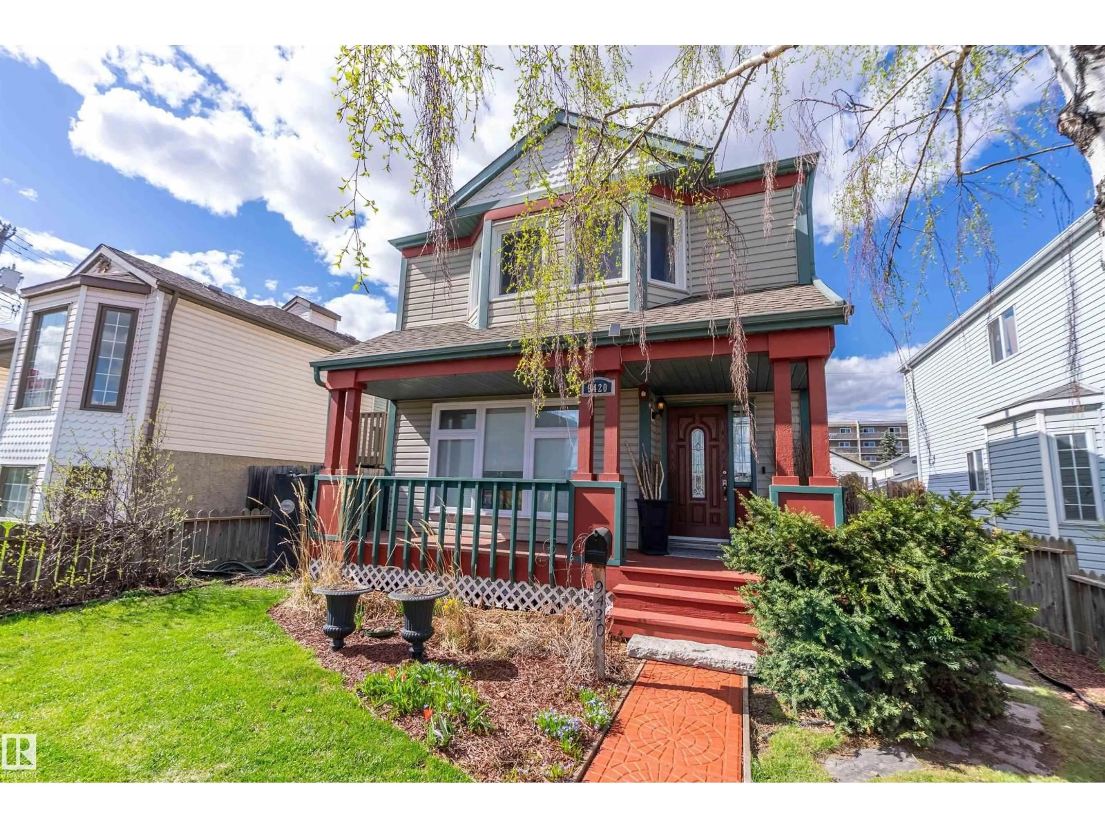 Home with vinyl exterior material, street for 9420 102A AV, Edmonton Alberta T5H4L7