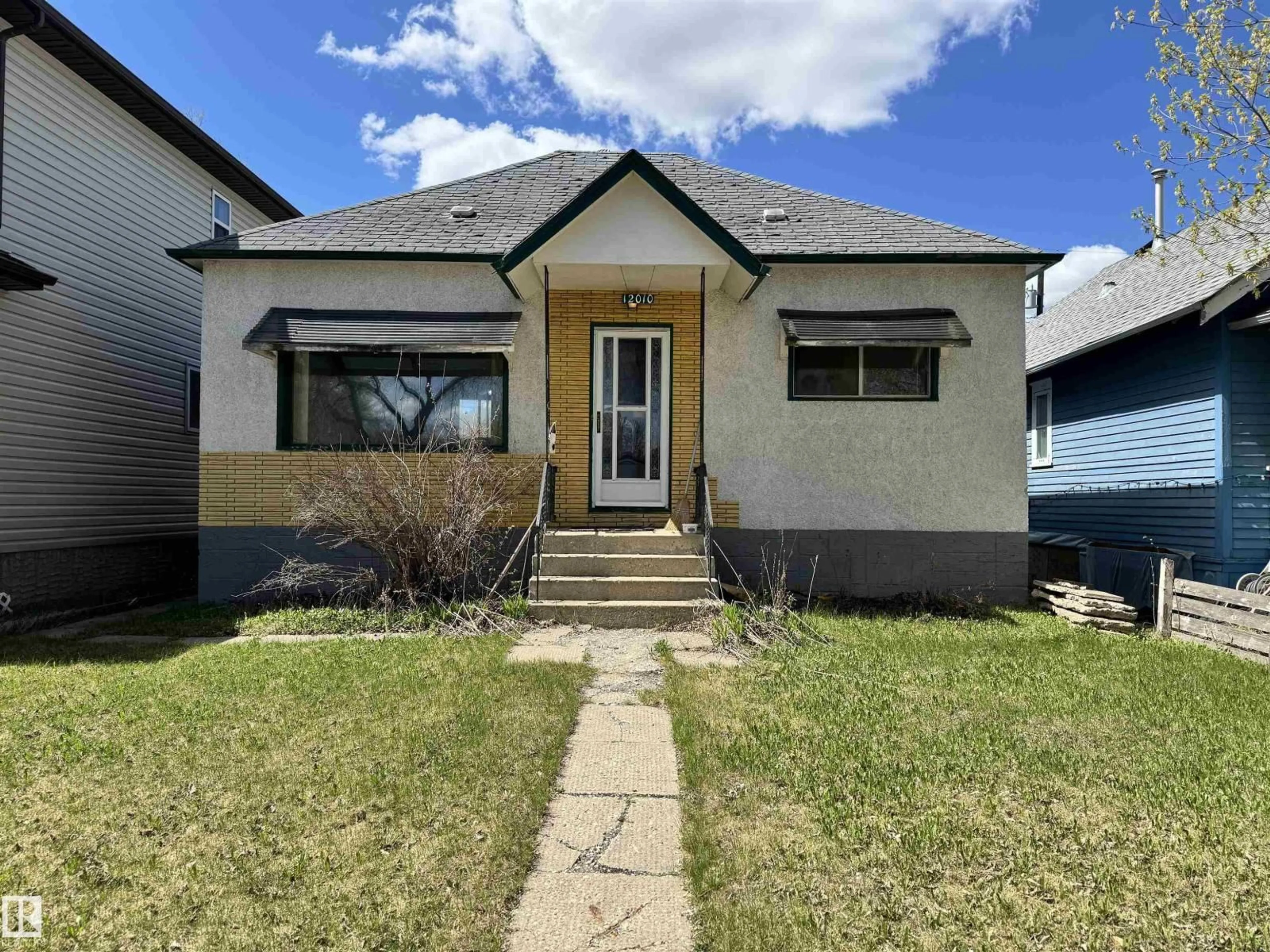 Home with vinyl exterior material, street for 12010 95 ST, Edmonton Alberta T5G1M7