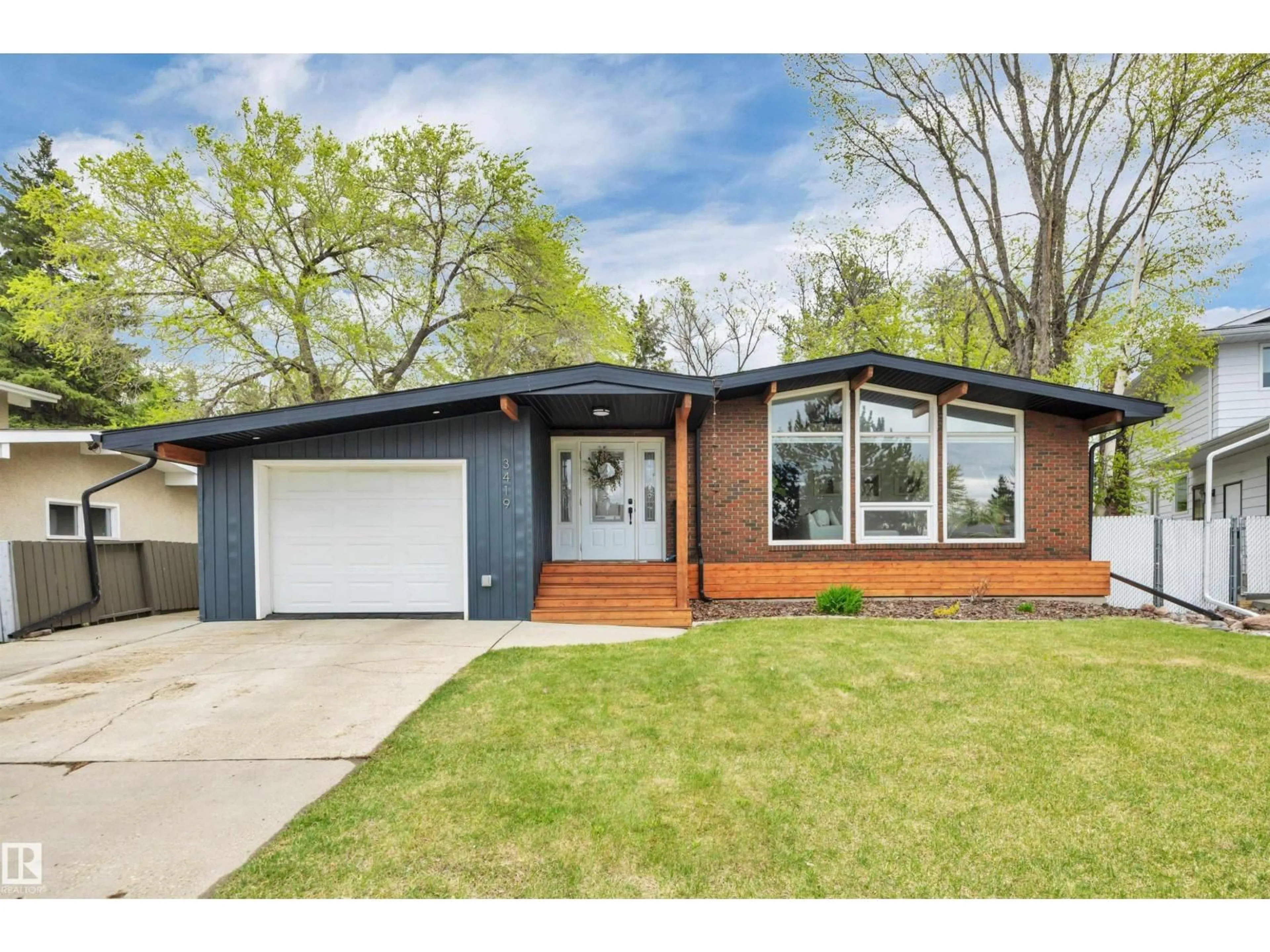 Home with brick exterior material, street for 3419 84 ST, Edmonton Alberta T6K0G9