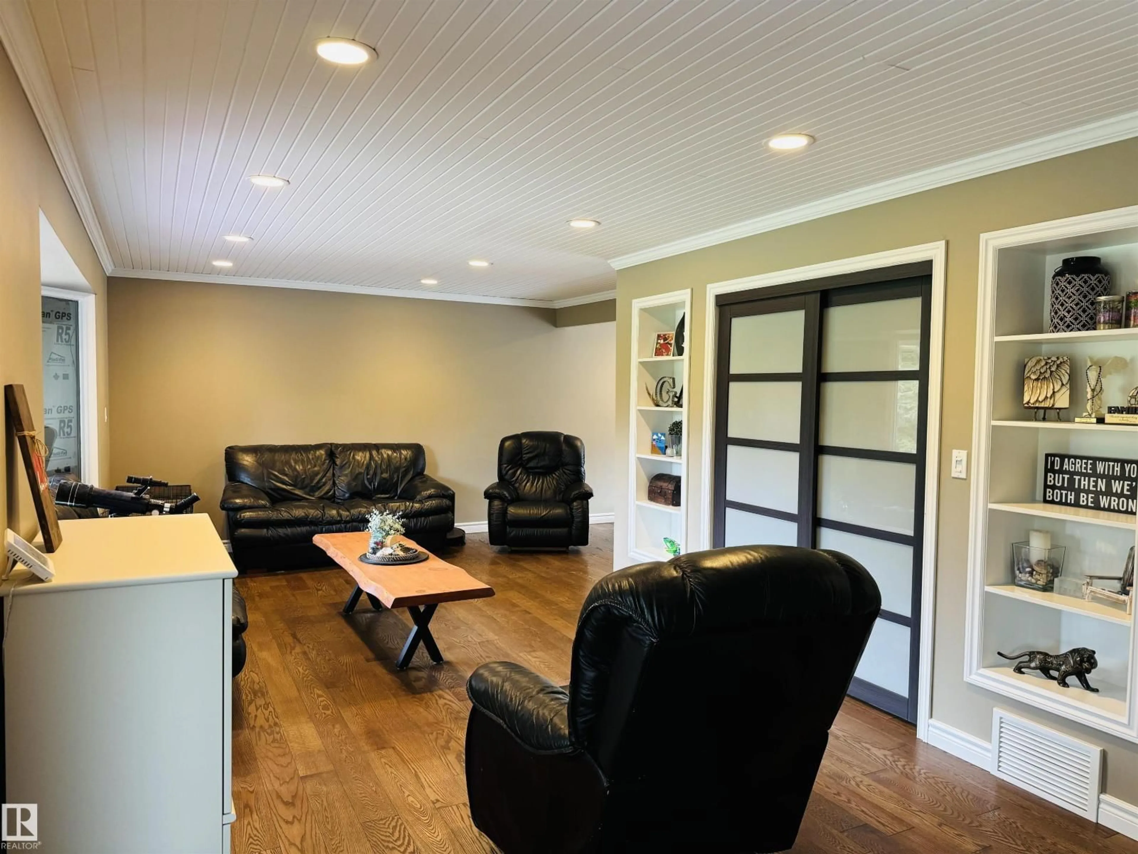 Living room with furniture, wood/laminate floor for 10 VISCOUNT DRIVE, Rural Sturgeon County Alberta T8T0E1