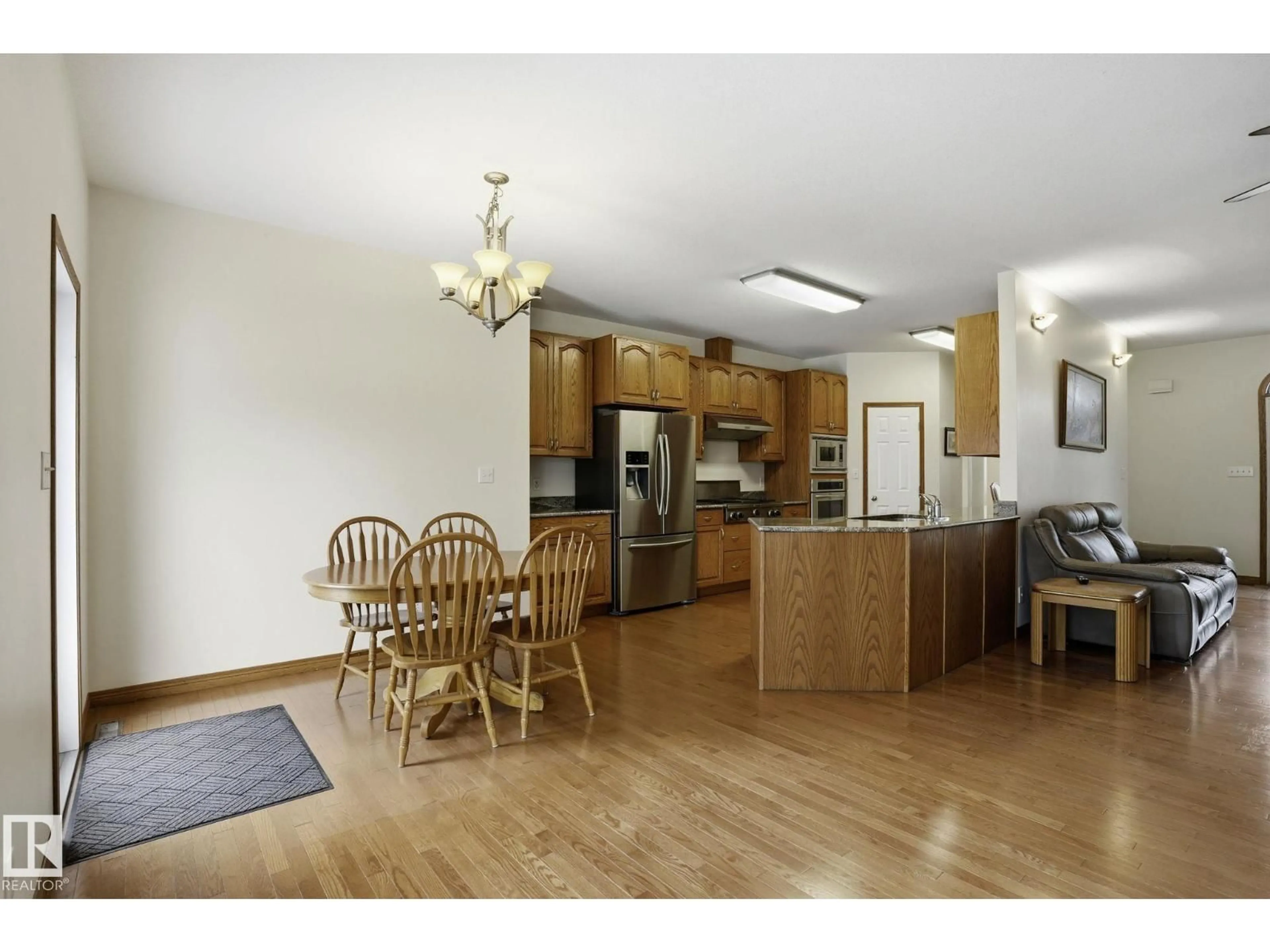 Open concept kitchen, wood/laminate floor for 54 53521 RGE ROAD 272, Rural Parkland County Alberta T7X3M5