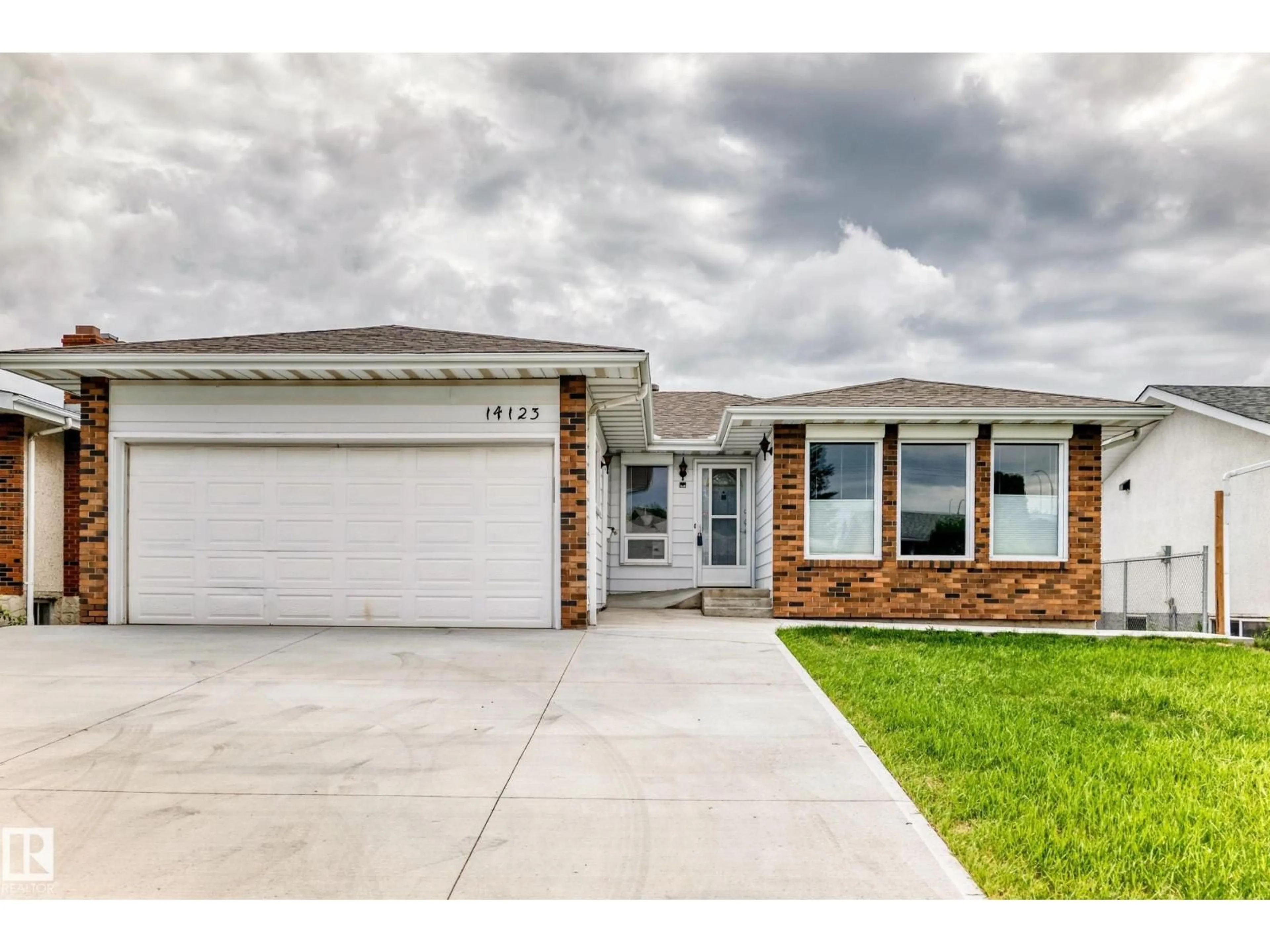 Home with vinyl exterior material, street for 14123 96 ST, Edmonton Alberta T5E5Z3