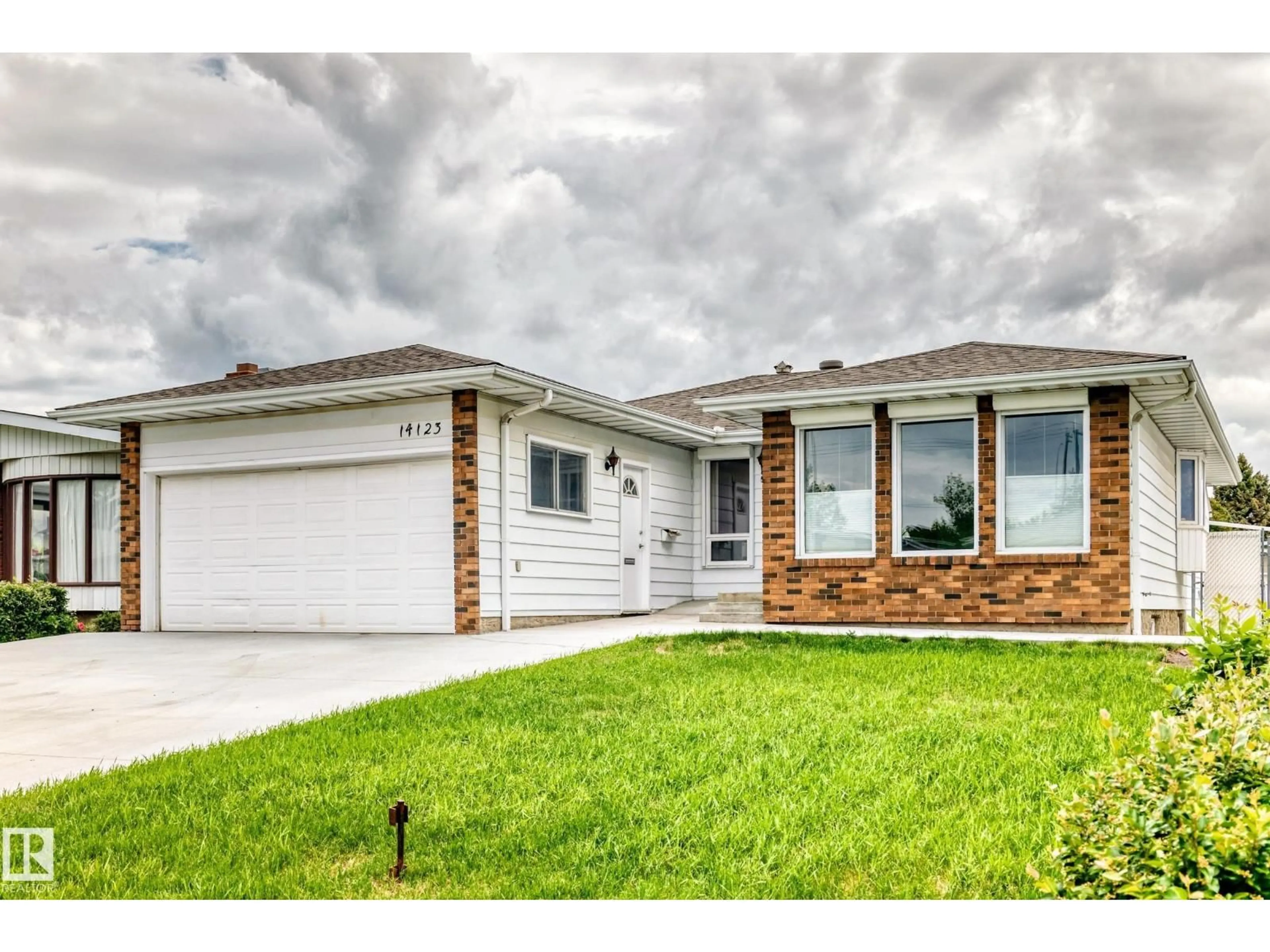 Home with vinyl exterior material, street for 14123 96 ST, Edmonton Alberta T5E5Z3