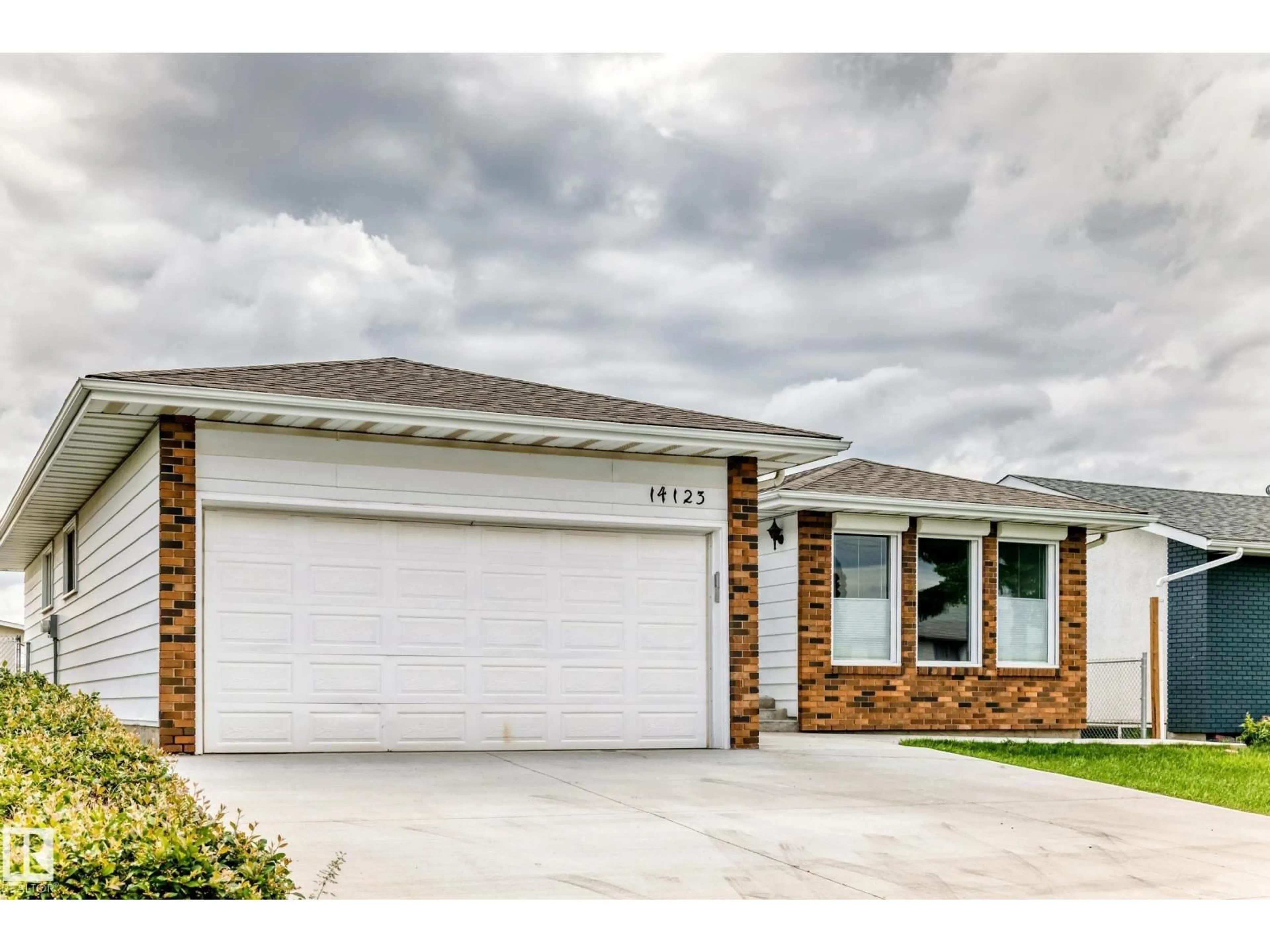Home with brick exterior material, street for 14123 96 ST, Edmonton Alberta T5E5Z3