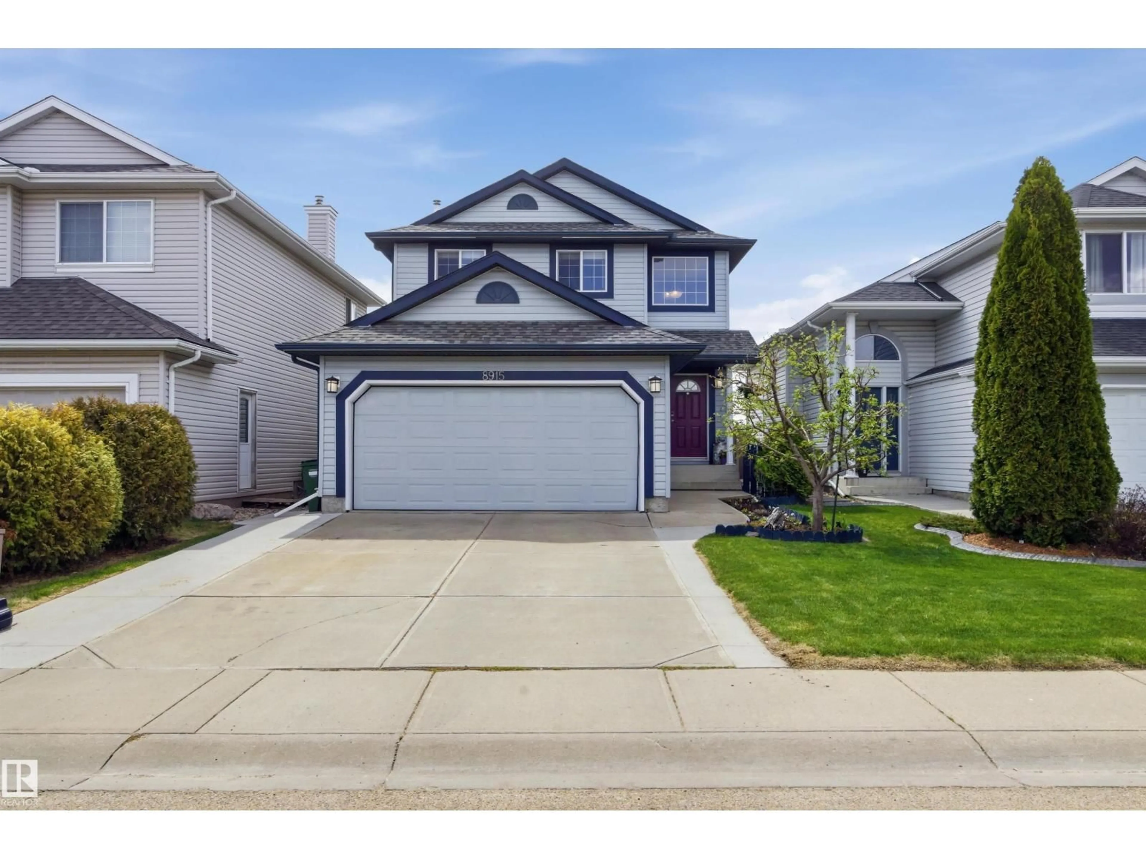 Home with vinyl exterior material, street for 8915 8 AV, Edmonton Alberta T6X1B9