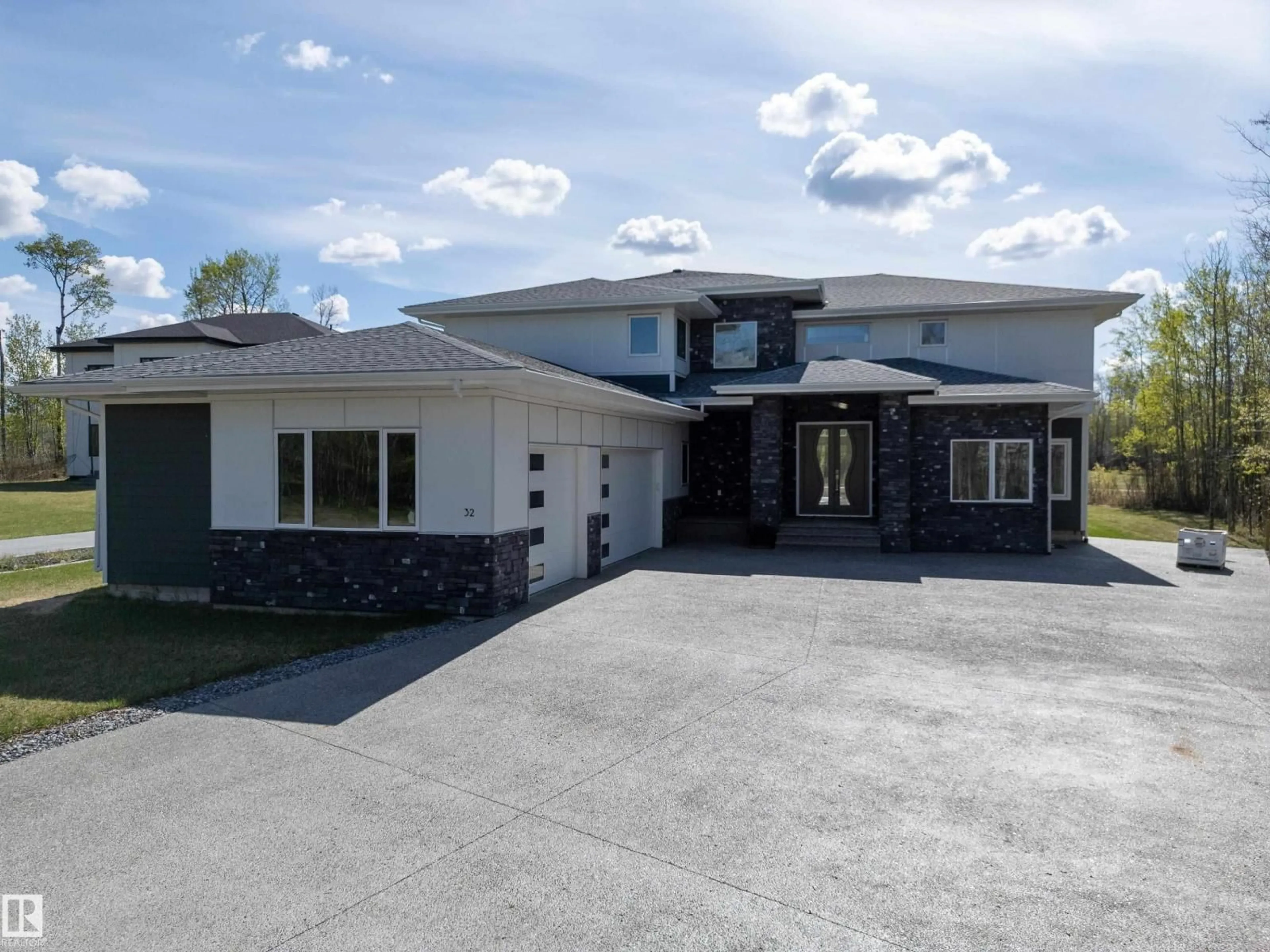 Home with vinyl exterior material, street for 51025 - 32 RANGE ROAD 222, Rural Strathcona County Alberta T8C1J5