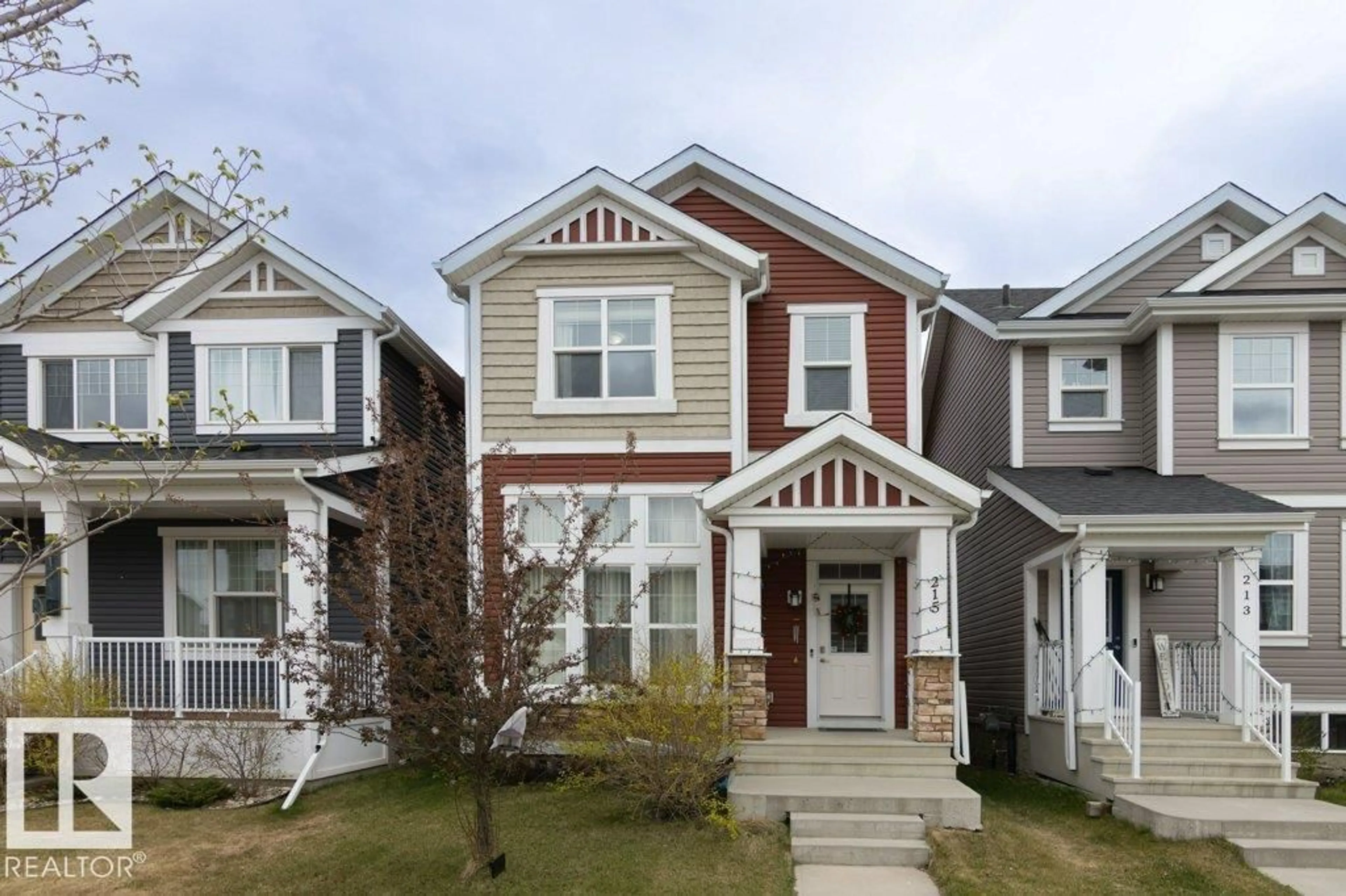 Home with vinyl exterior material, street for 215 SOUTHFORK DR, Leduc Alberta T9E1G3