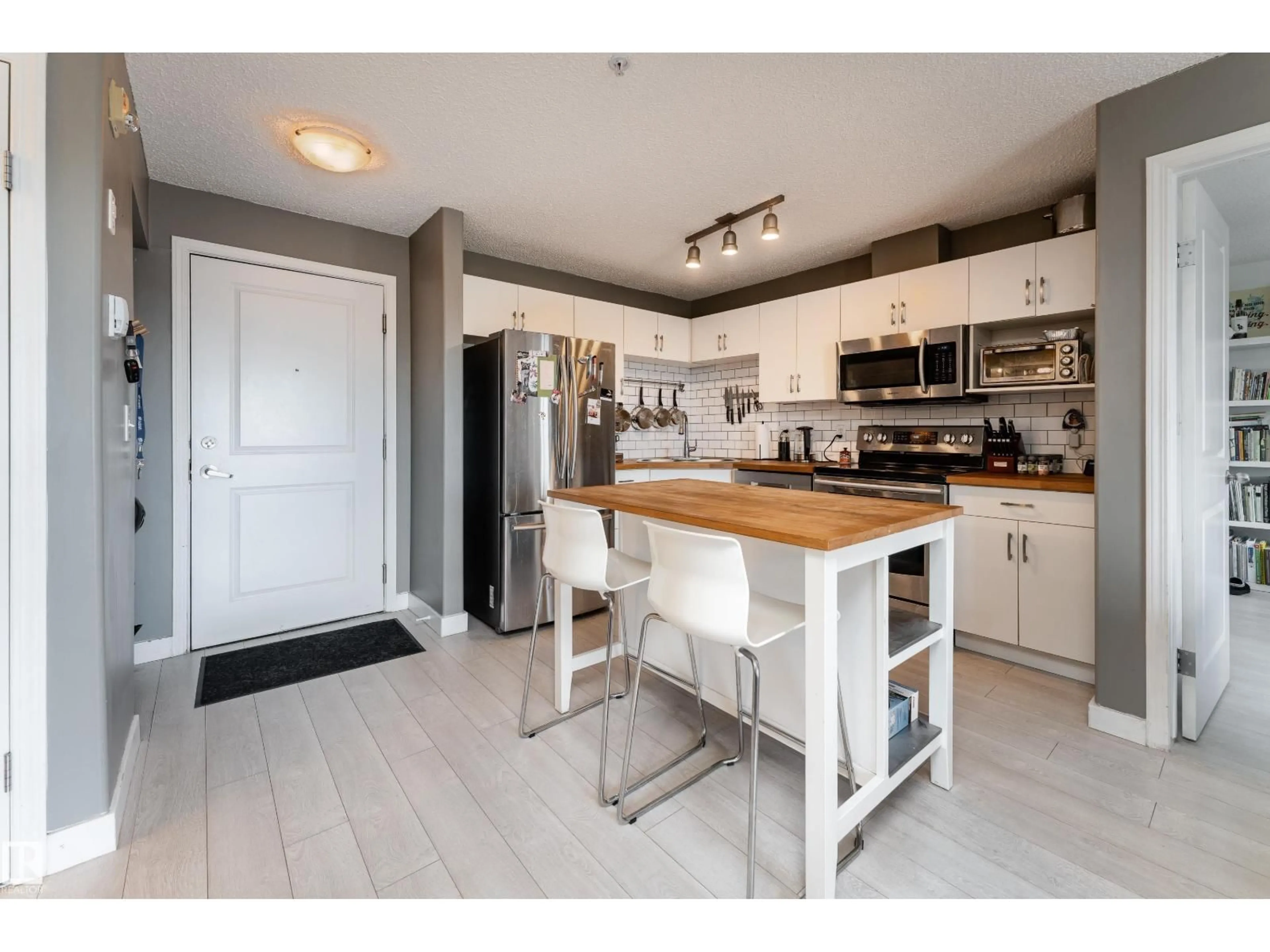 Open concept kitchen, wood/laminate floor for 408 - 10535 122 STREET NW, Edmonton Alberta T5N4B7