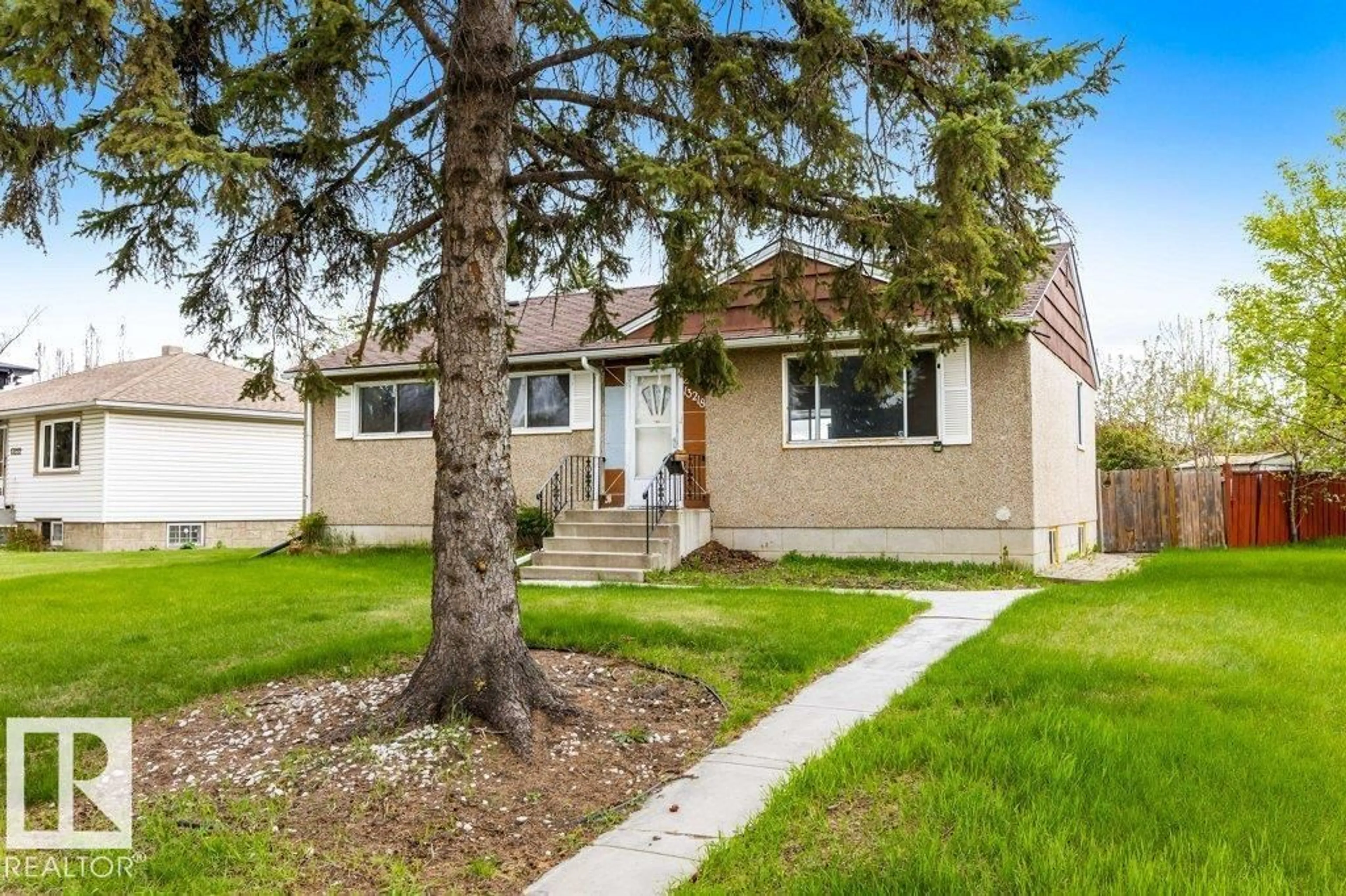 Home with vinyl exterior material, street for 13218 116 AV, Edmonton Alberta T5M3E2