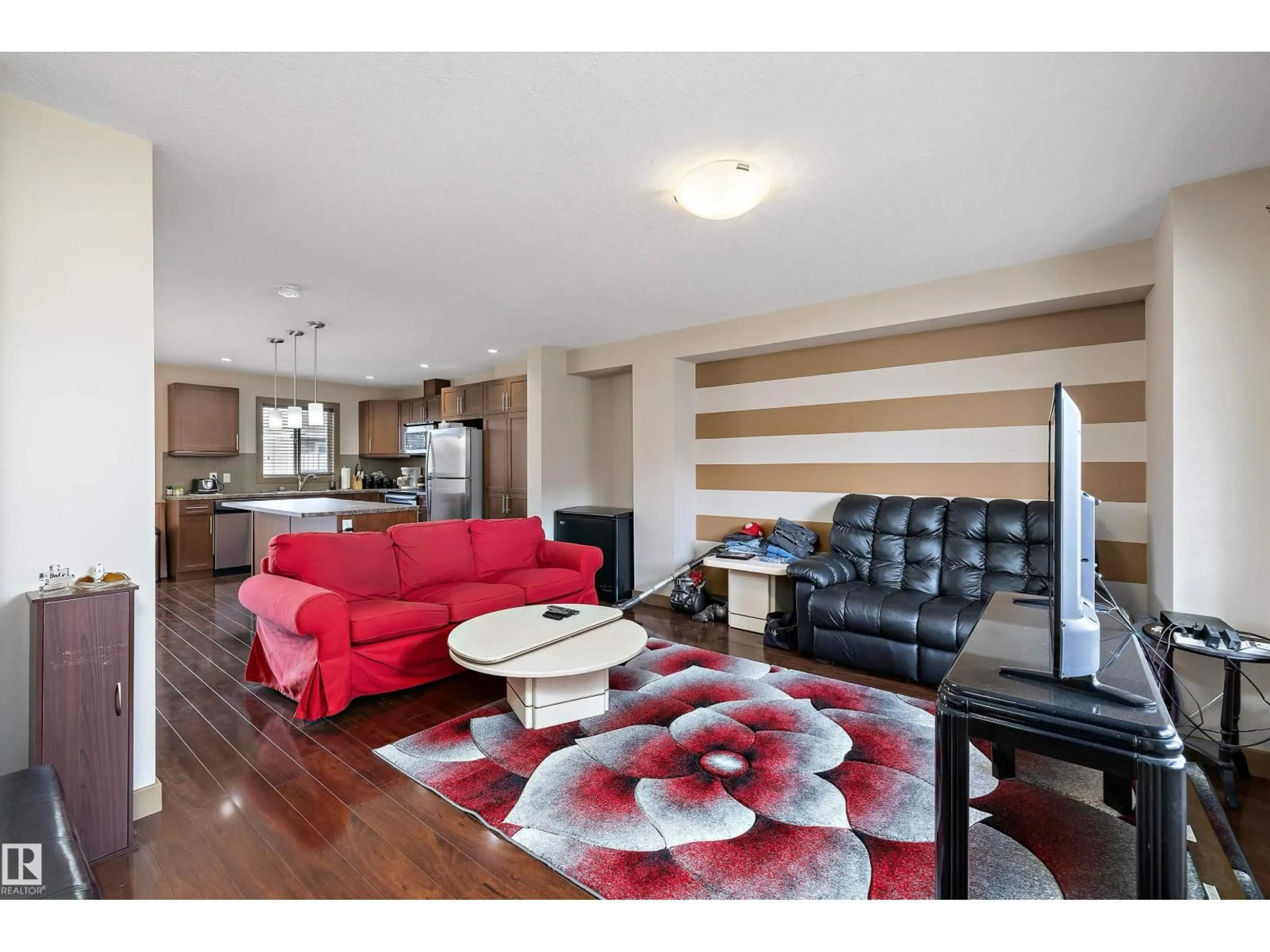 Living room with furniture, wood/laminate floor for #403 - 401 PALISADES WY, Sherwood Park Alberta T8H0R7