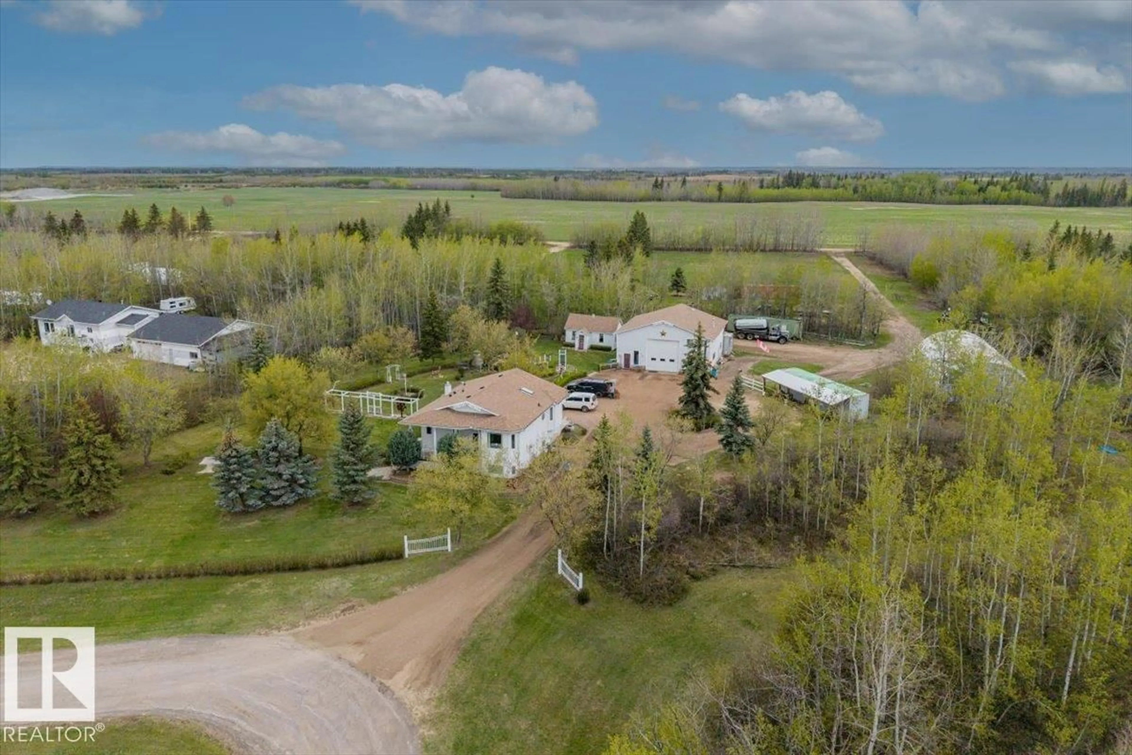 A pic from outside/outdoor area/front of a property/back of a property/a pic from drone, unknown for #11 - 22515 TWP ROAD 575 A, Rural Sturgeon County Alberta T0A1N6
