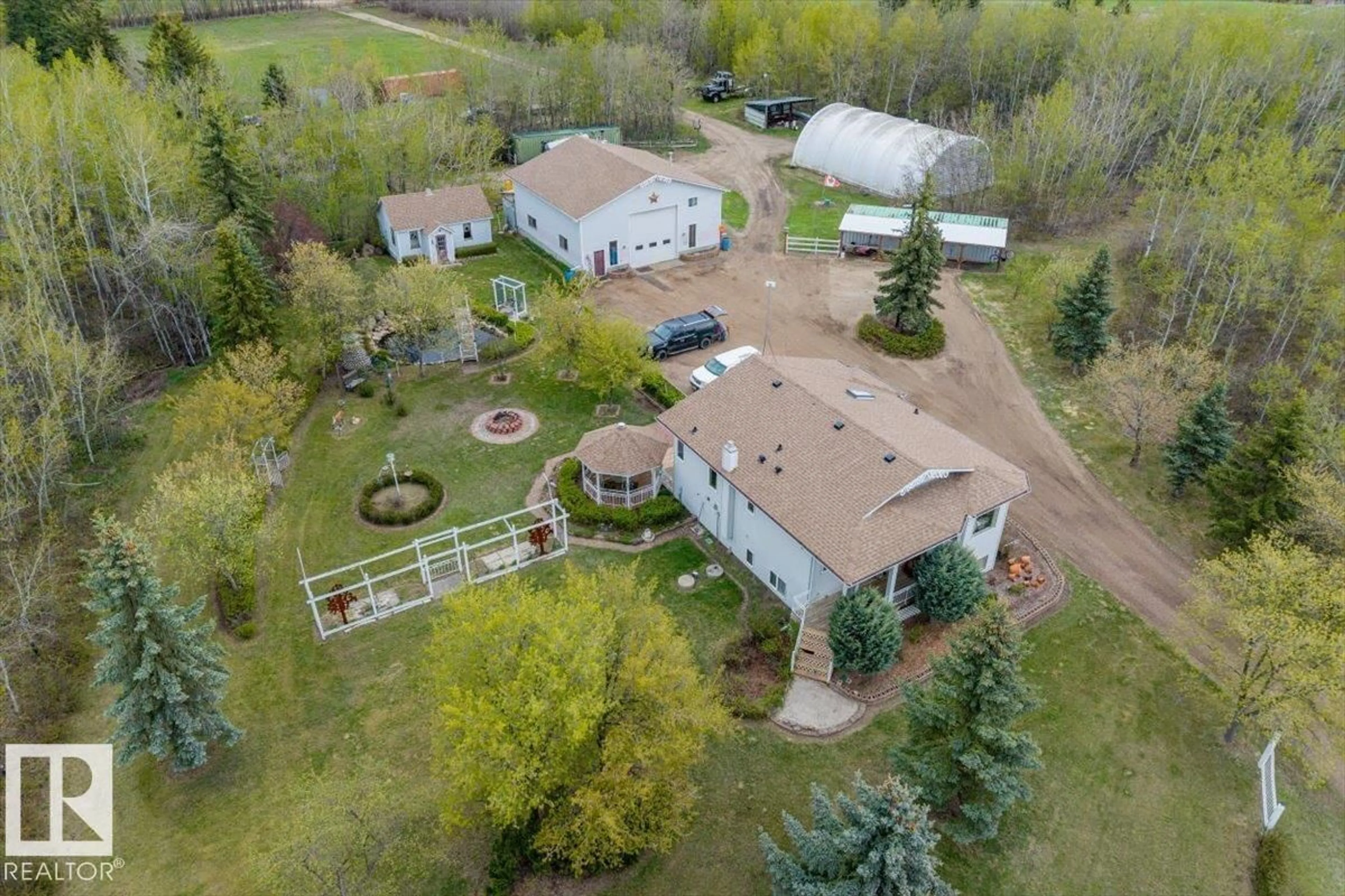 A pic from outside/outdoor area/front of a property/back of a property/a pic from drone, unknown for #11 - 22515 TWP ROAD 575 A, Rural Sturgeon County Alberta T0A1N6