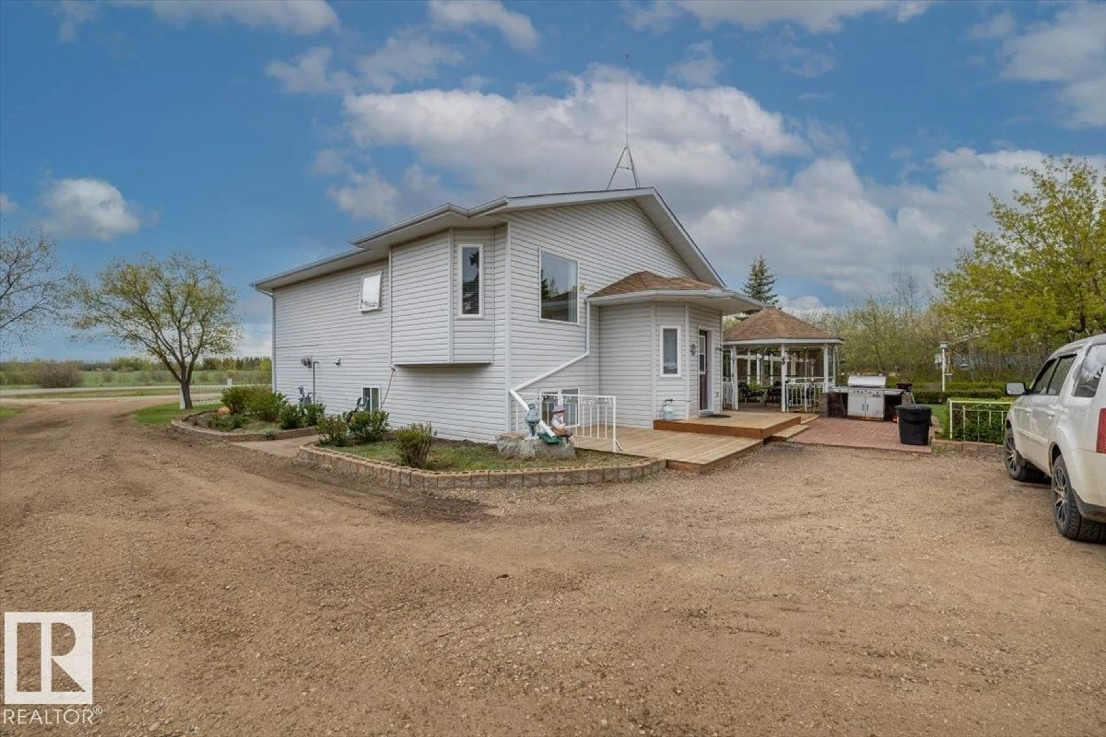 A pic from outside/outdoor area/front of a property/back of a property/a pic from drone, unknown for #11 - 22515 TWP ROAD 575 A, Rural Sturgeon County Alberta T0A1N6