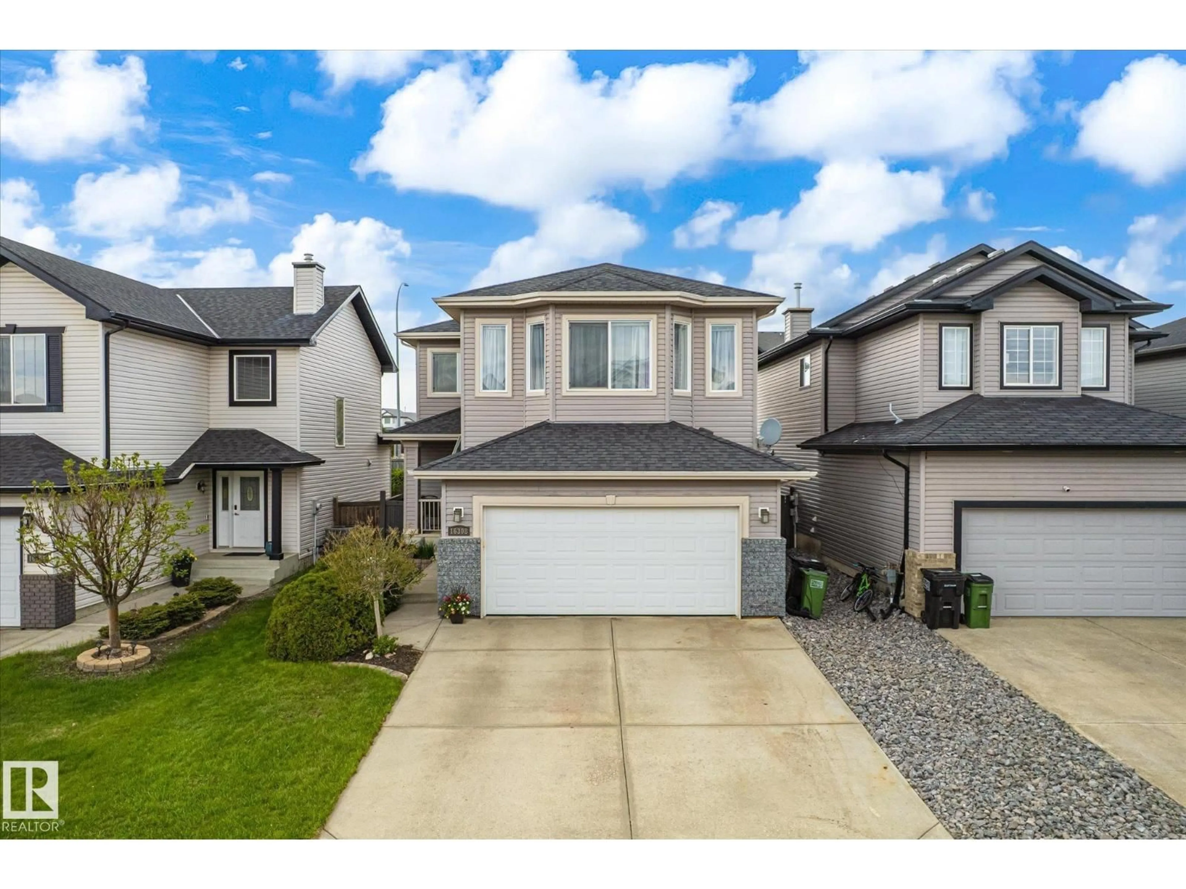 Home with vinyl exterior material, street for NW - 16308 49 ST, Edmonton Alberta T5Y3H8