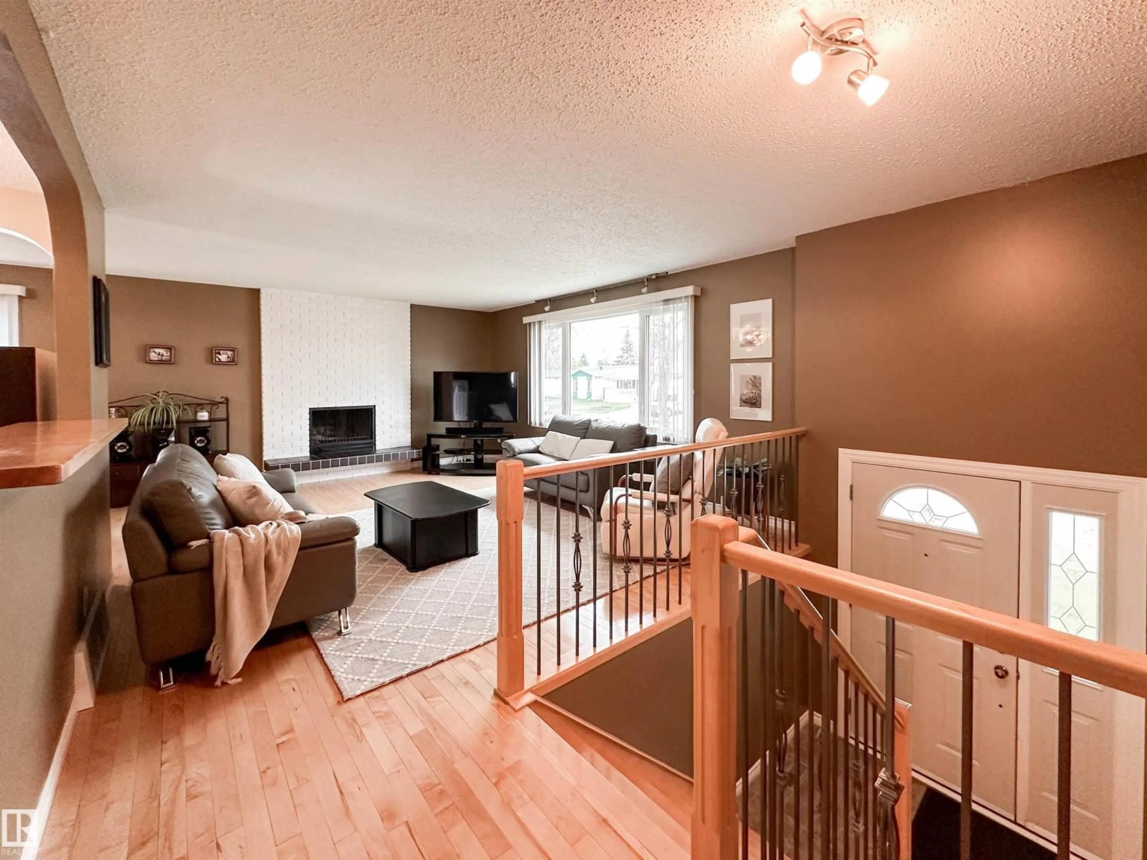 Living room with furniture, wood/laminate floor for 53 ALPINE BV, St. Albert Alberta T8N2M1