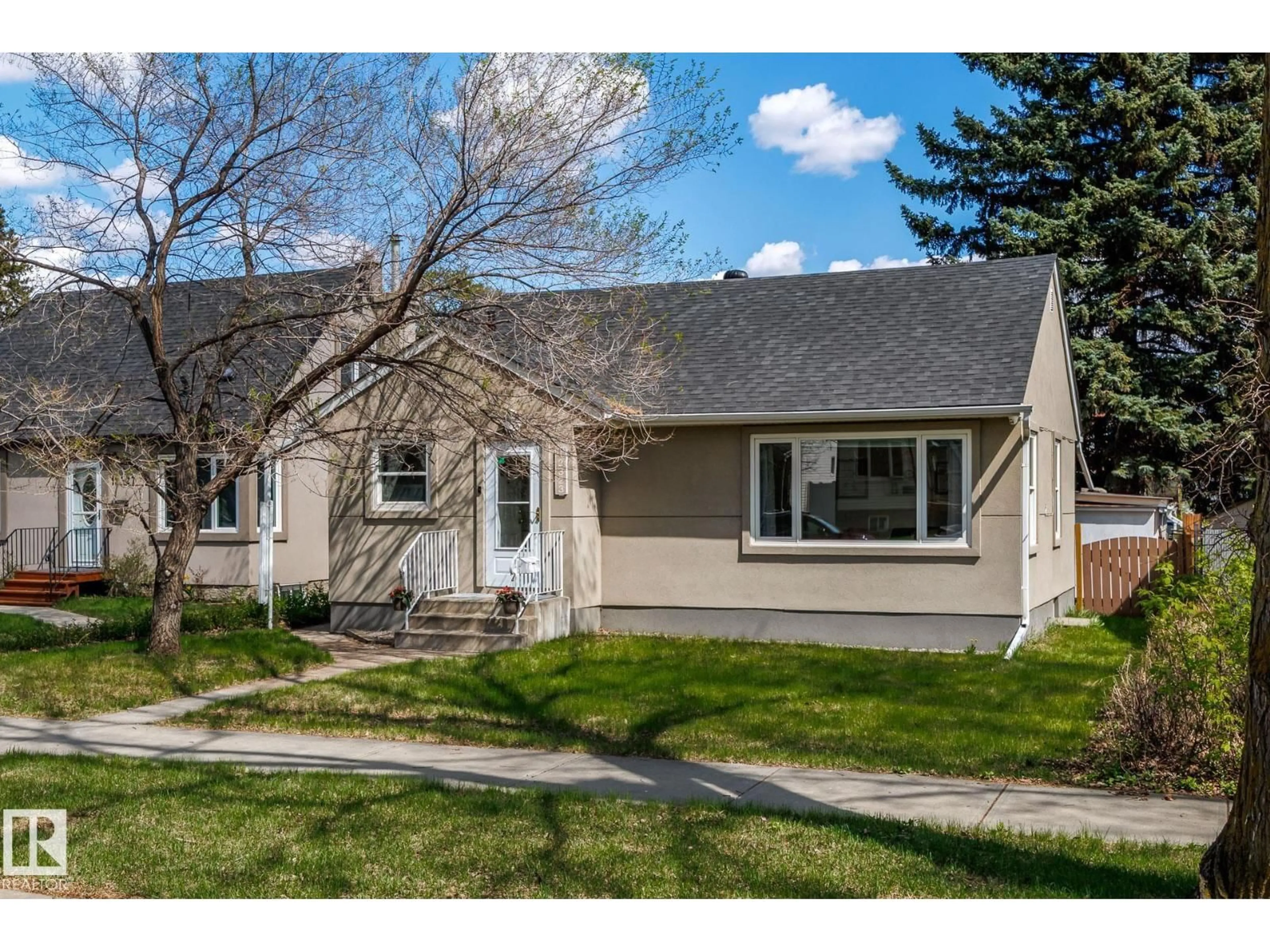 Home with vinyl exterior material, street for NW - 12323 104 ST, Edmonton Alberta T5G2L9
