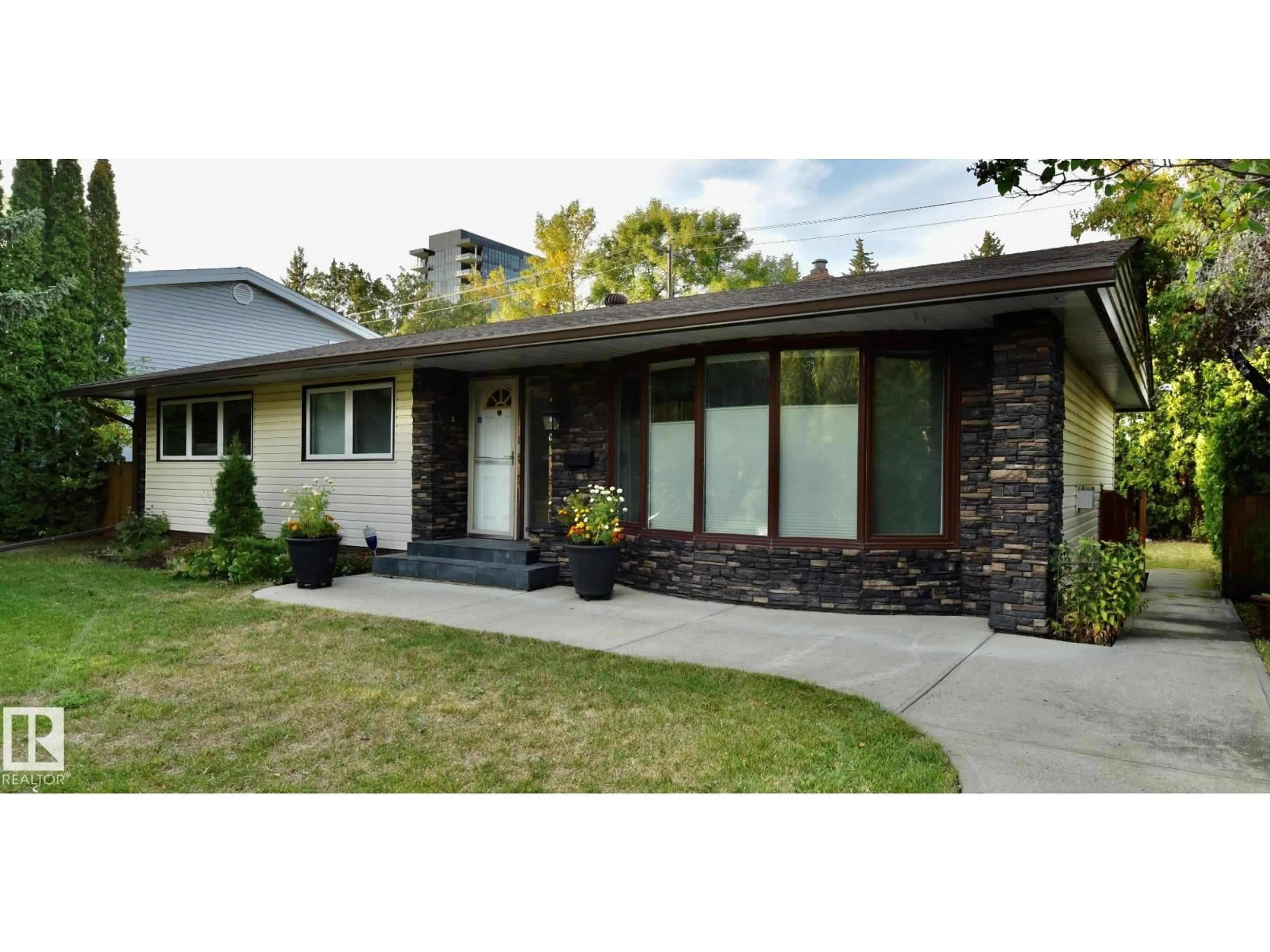 Home with brick exterior material, street for 13910 101A AV, Edmonton Alberta T5N0L2