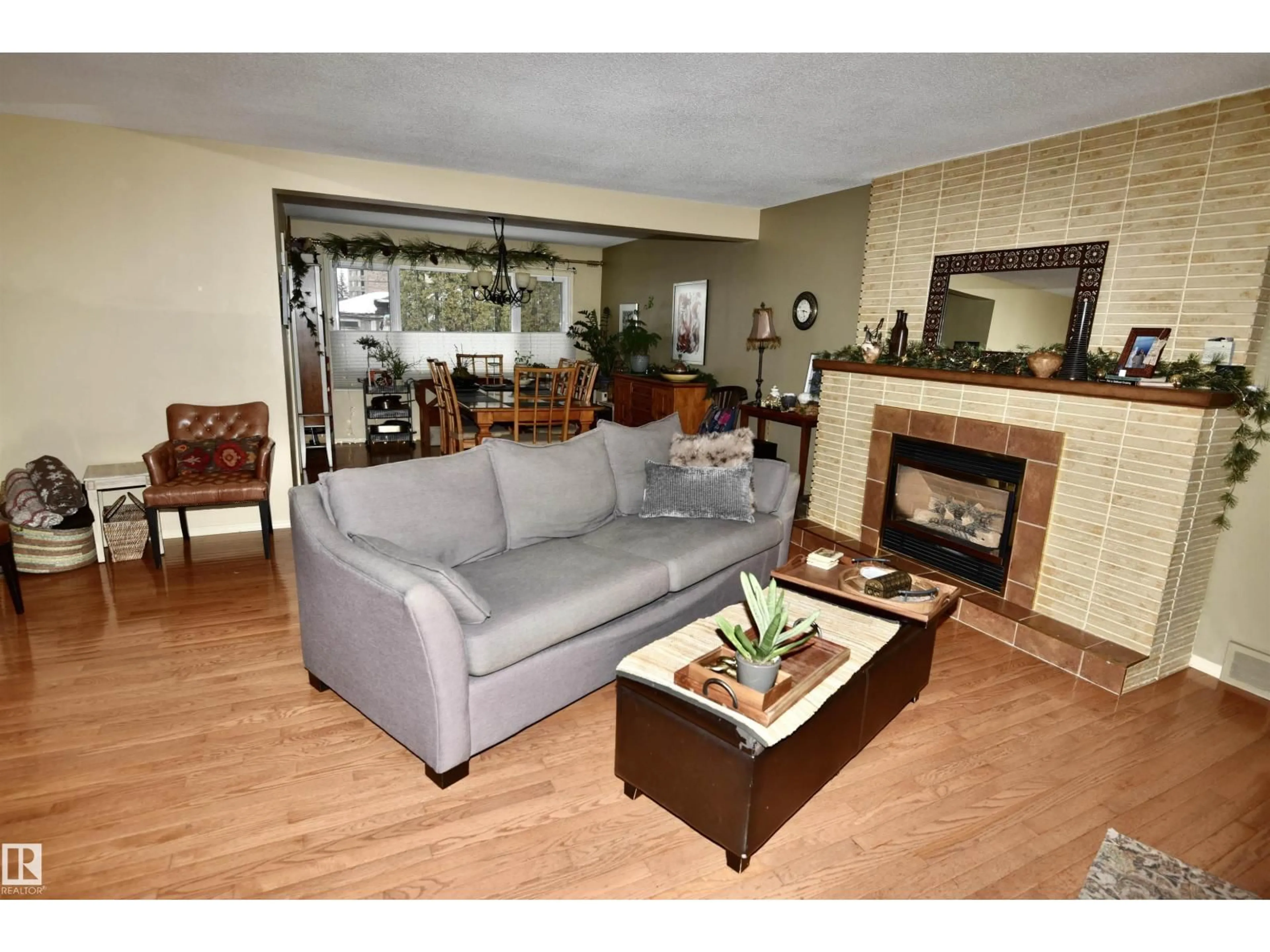Living room with furniture, wood/laminate floor for 13910 101A AV, Edmonton Alberta T5N0L2