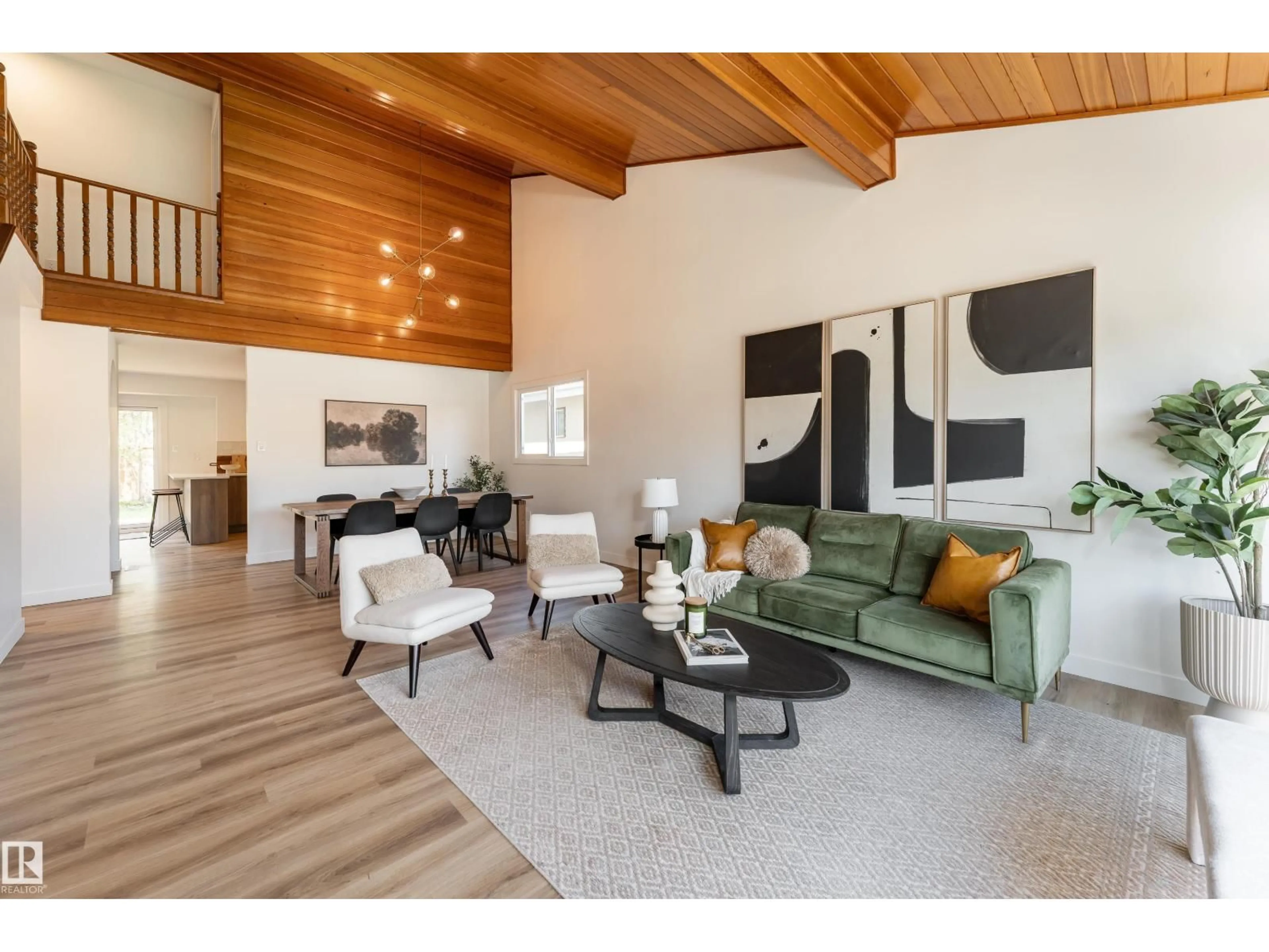 Living room with furniture, wood/laminate floor for NW - 6410 187A ST, Edmonton Alberta T5T2N4