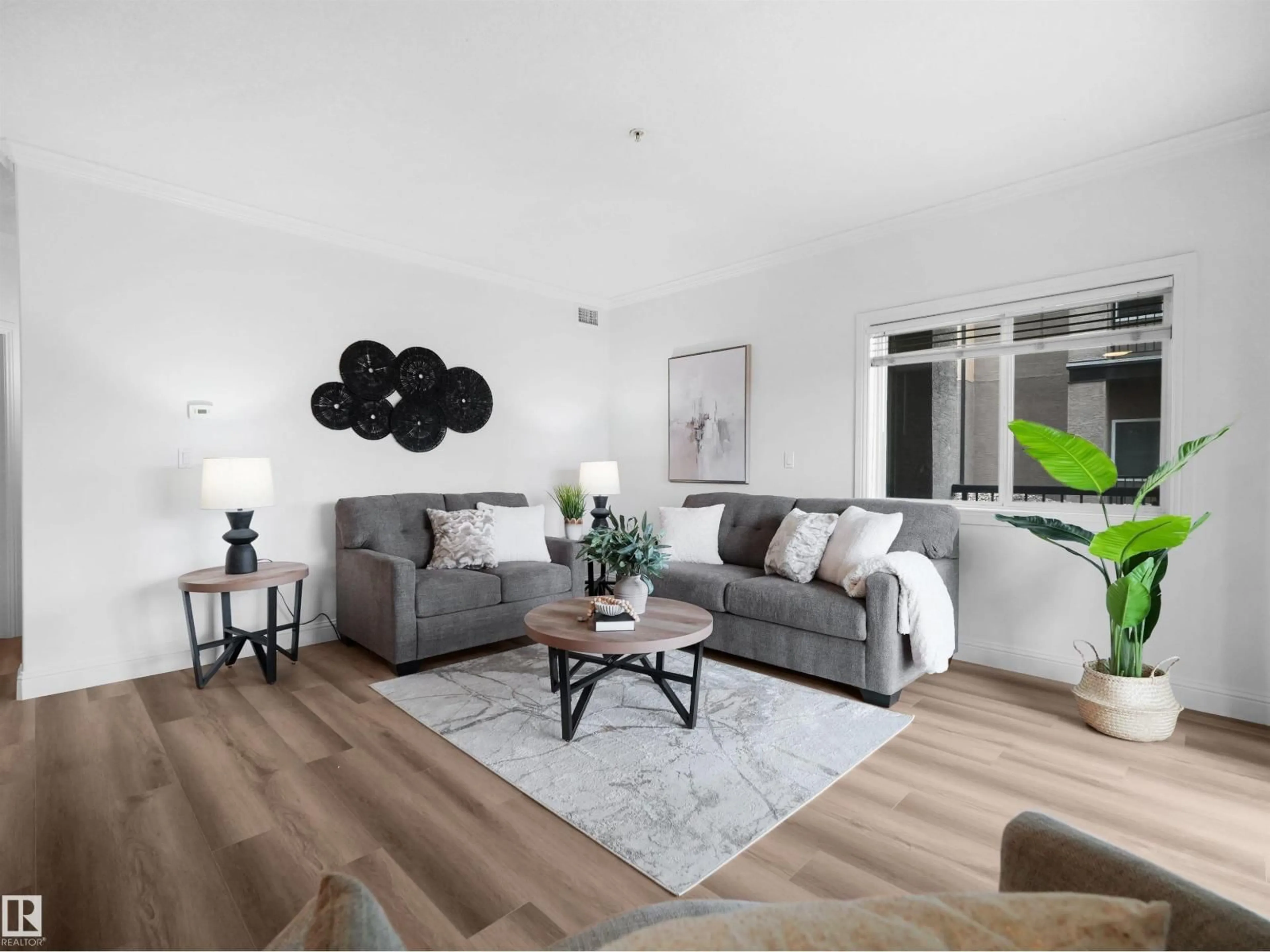 Living room with furniture, wood/laminate floor for #104 - 14612 125 ST, Edmonton Alberta T5X0B6