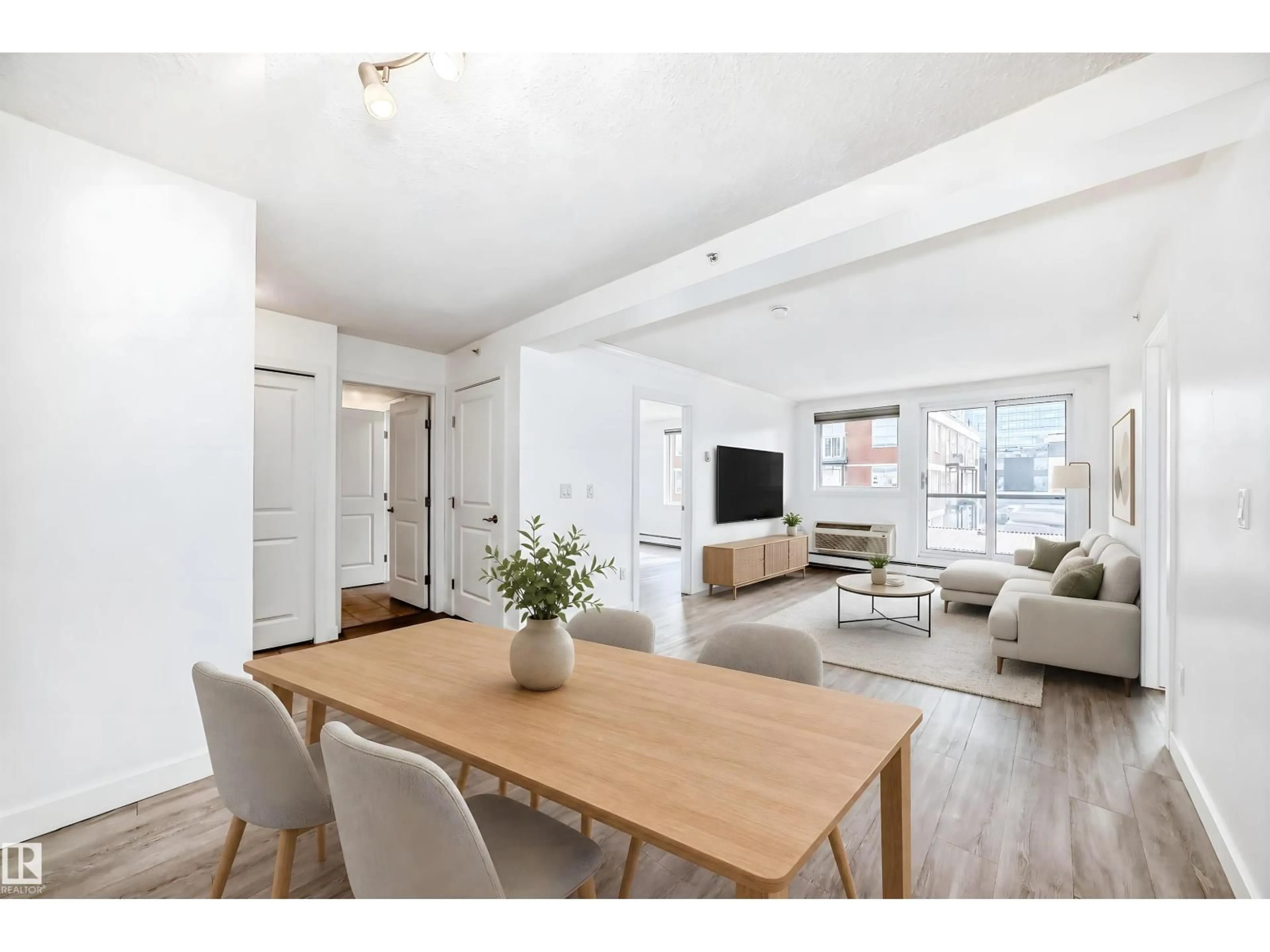 Living room with furniture, wood/laminate floor for 304 - 10303 105 ST, Edmonton Alberta T5J5G3