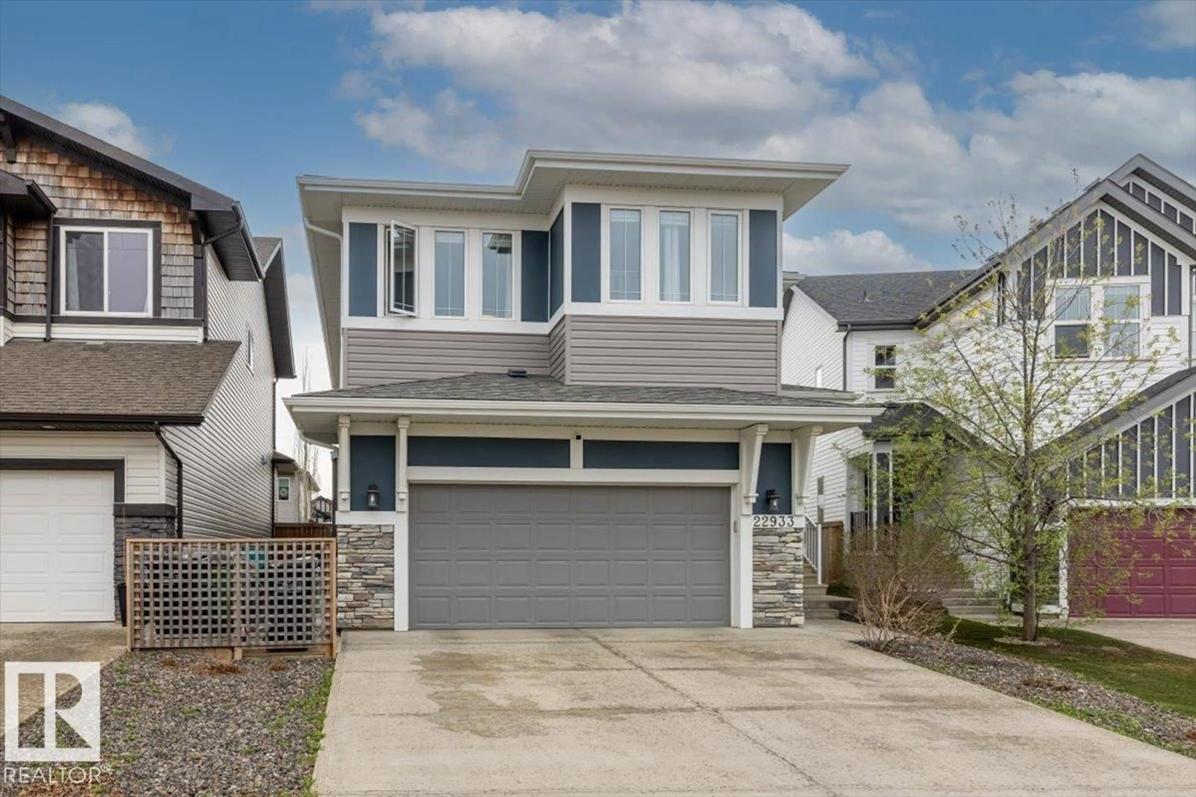 Home with vinyl exterior material, street for 22933 94A AV, Edmonton Alberta T5T7B5