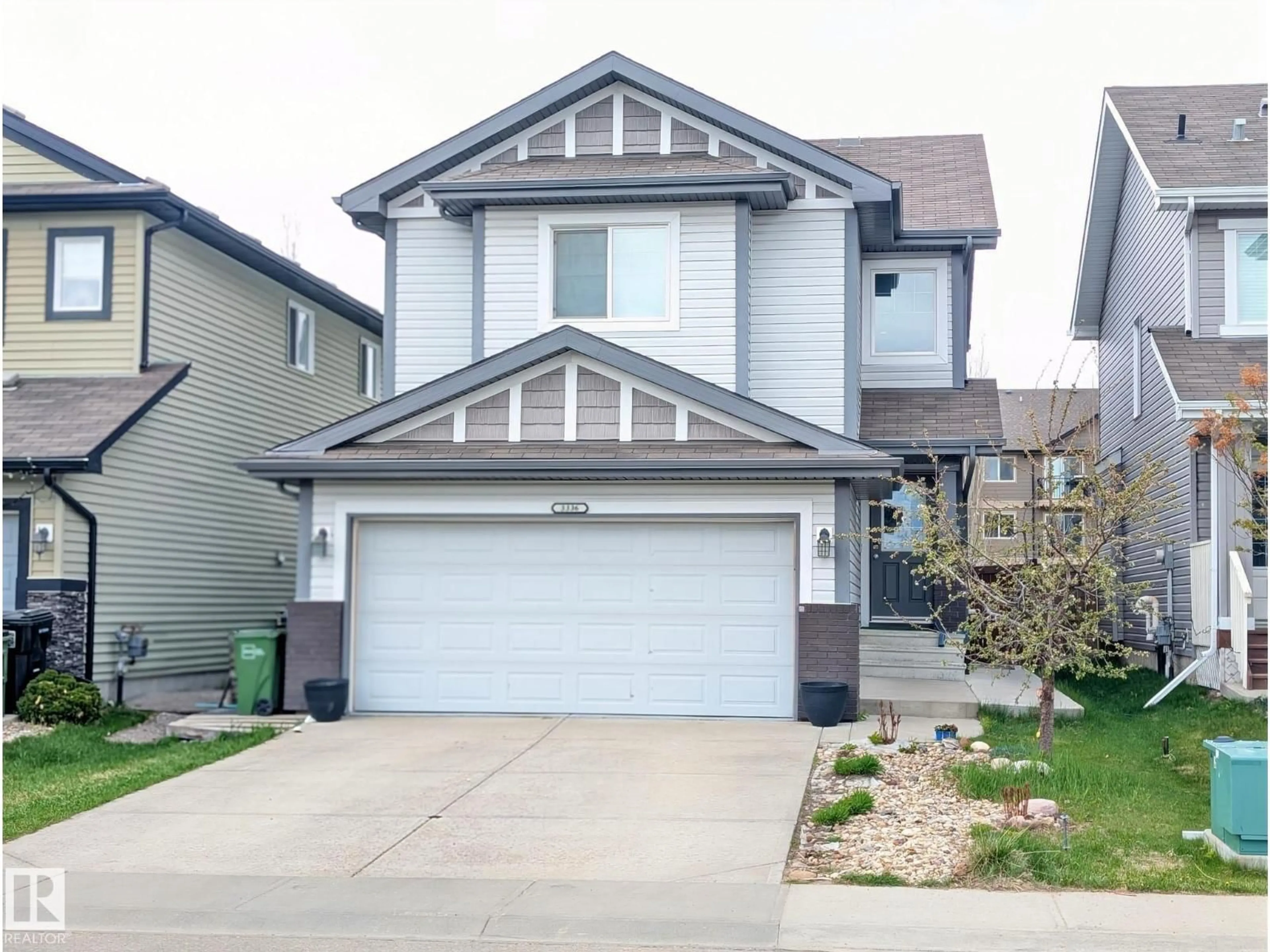 Home with vinyl exterior material, street for NW - 3336 17B AV, Edmonton Alberta T6T0P3