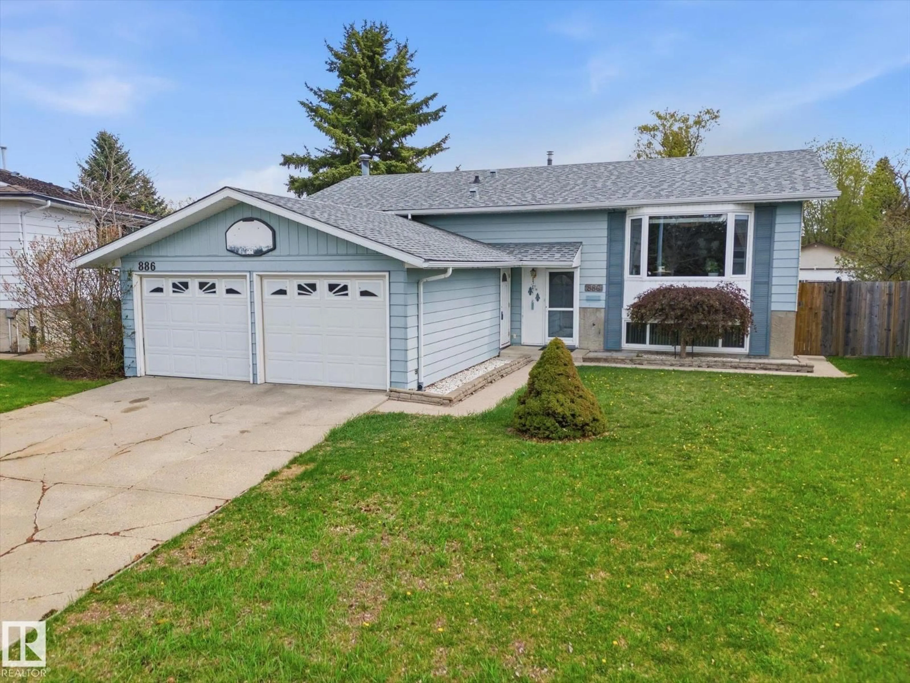 Home with vinyl exterior material, street for 886 KNOTTWOOD RD, Edmonton Alberta T6K3C3